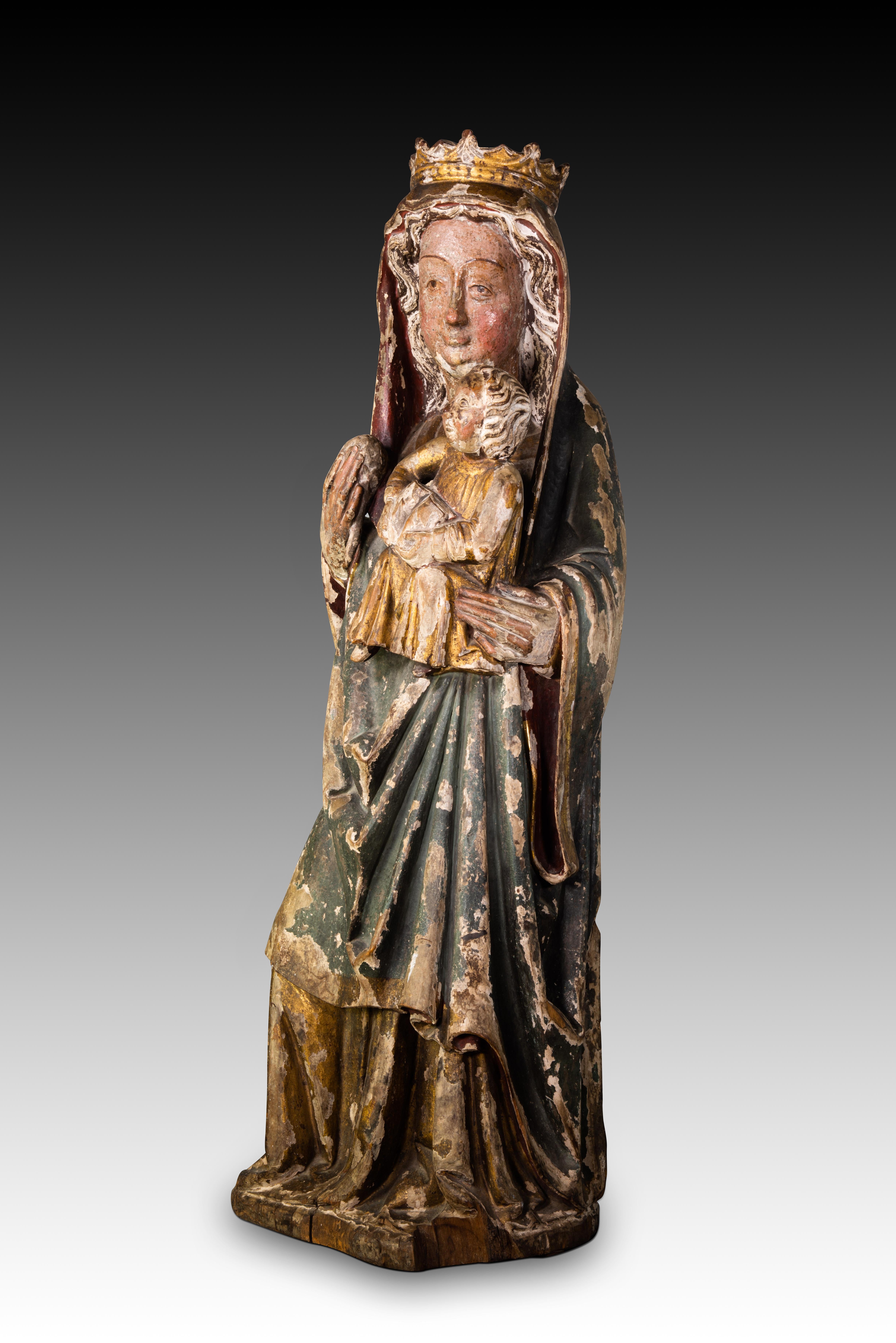 Virgin with Child. Carved and polychrome wood. Spanish school, 19th century.
 It has faults.
 Carving made of polychrome wood that shows the Virgin Mary, standing and with a spherical object in her right hand, with the Child Jesus in her left arm,