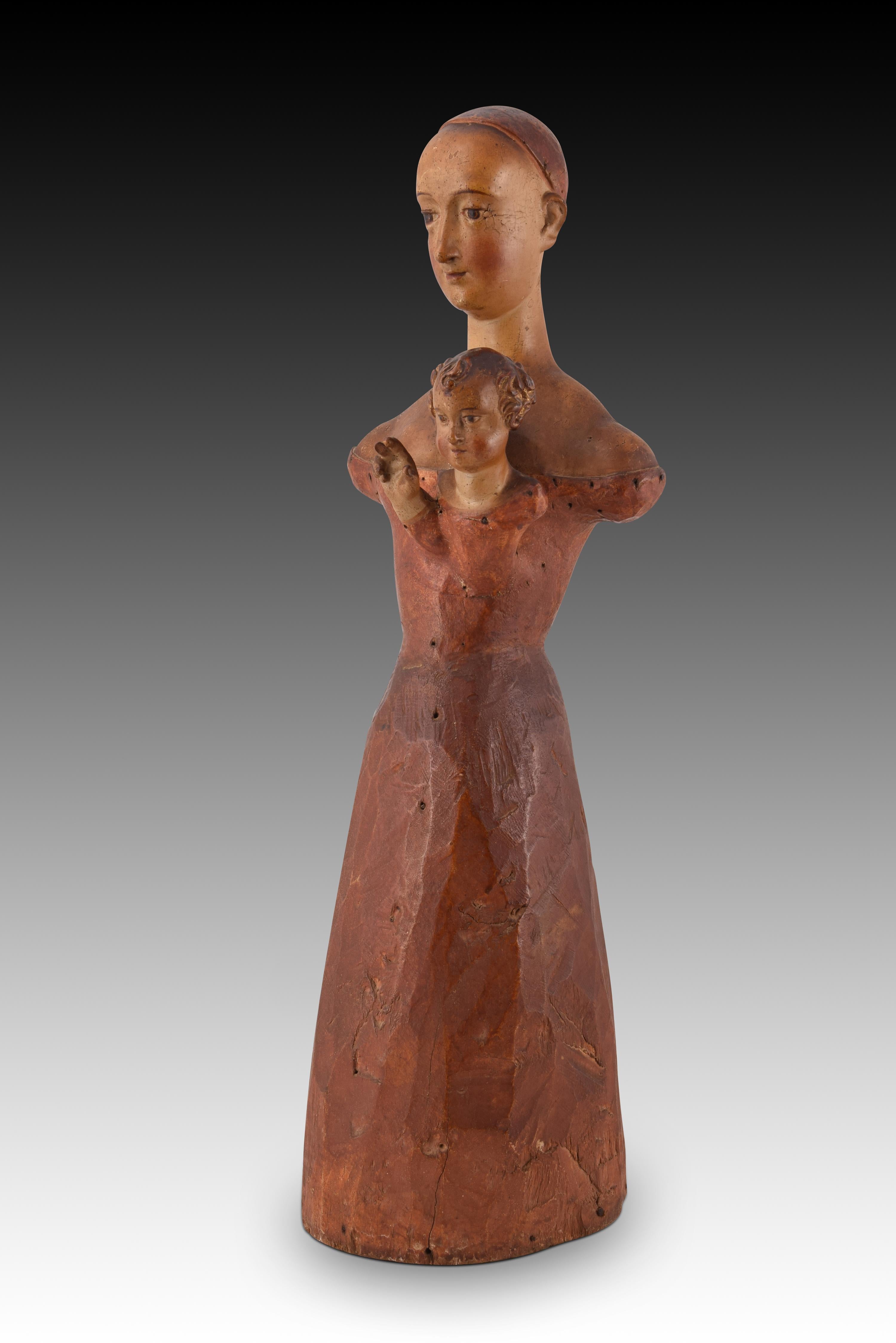 Virgin and Child dress. Carved and polychrome wood. Spanish school, 17th century. 
Partially polychrome wood carving that shows a practically only roughened area and, at the top, the head and shoulders of a Virgin Mary (with the skull to accept hair