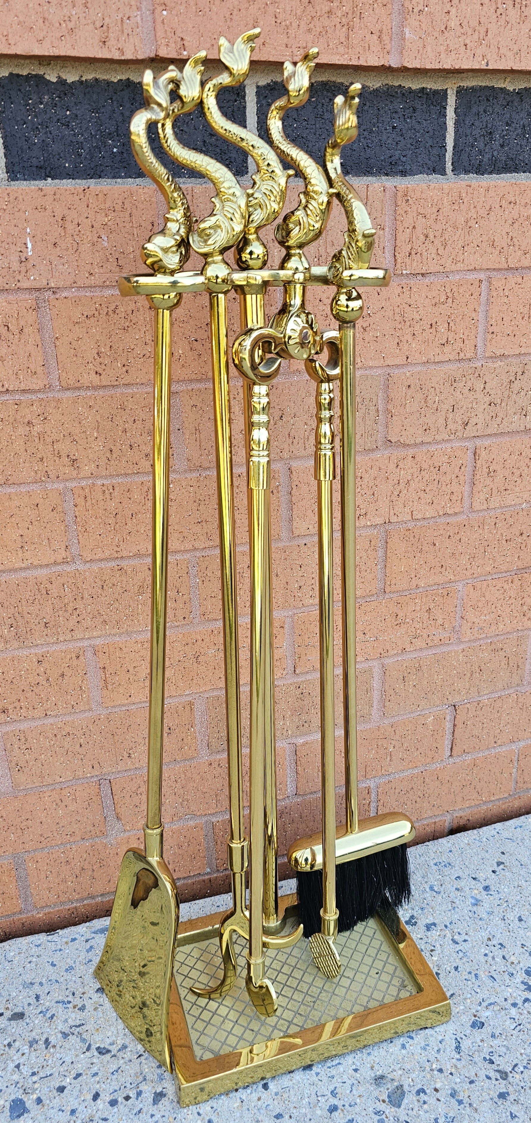 An exquisite set  of Federal Style Polished Brass Dolphin Fireplace Tool Set by Virginia Metal Crafters. Excellent vintage condition.
Virtually unused. Cast brass polished. 
Stand with four tools as pictured