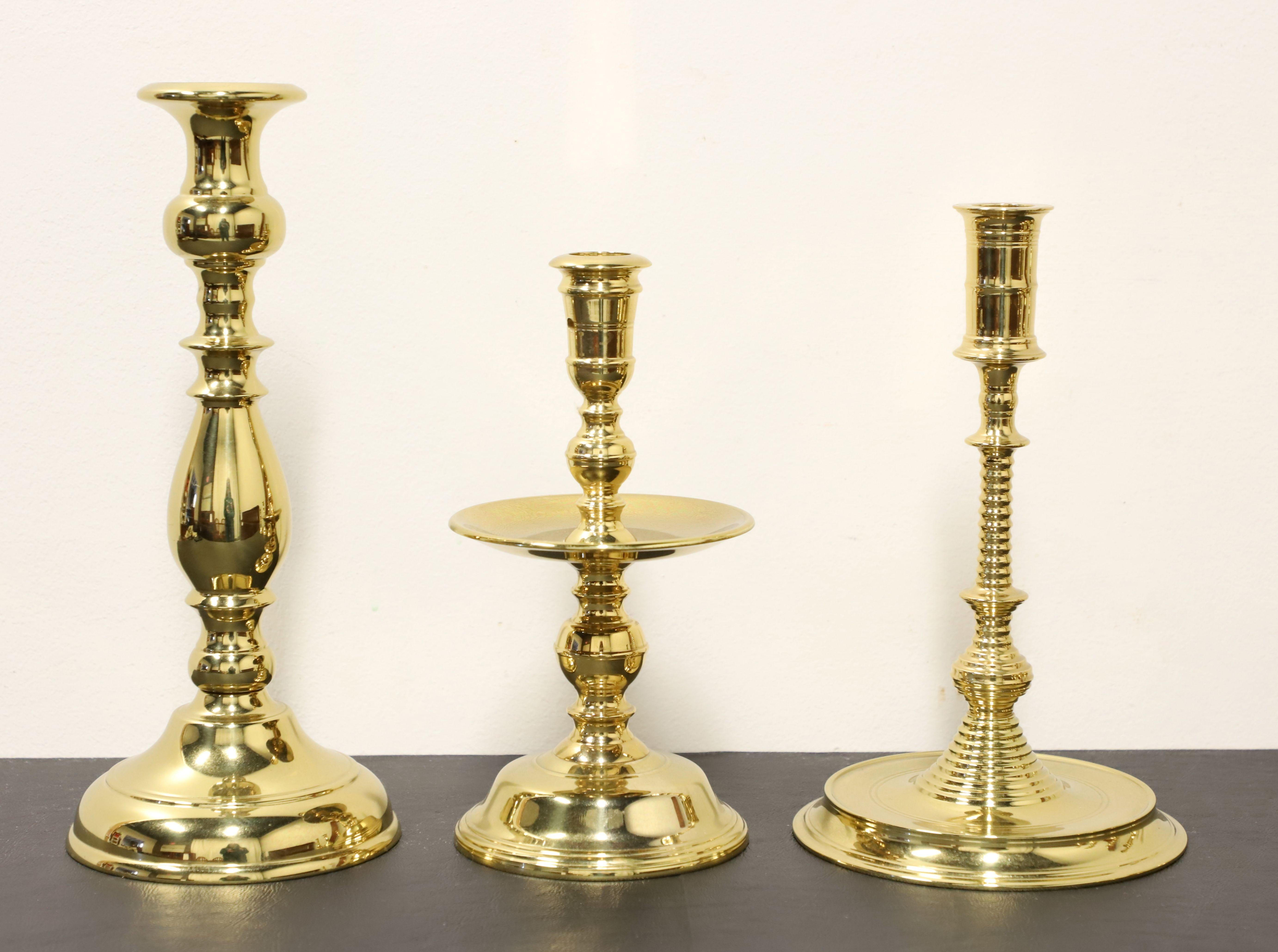 A lot of ten brass candlesticks by Virginia Metalcrafters. Each candlestick is solid brass and made for a single taper. Ten various shapes and sizes, with some being made exclusively for Colonial Williamsburg in Virginia, USA. Made in Virginia, USA,