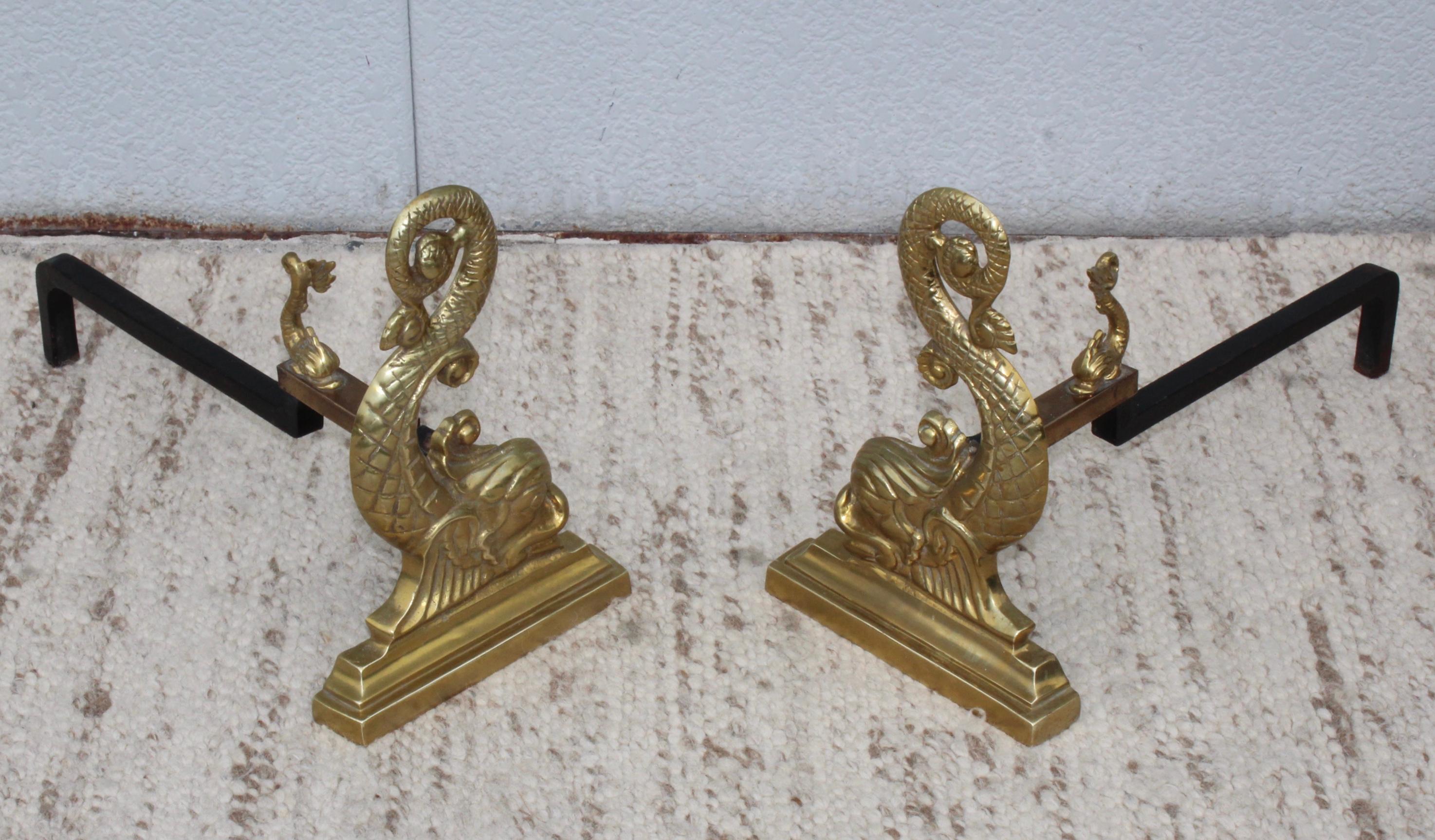 Stunning pair of solid brass and irons Dolphins andirons by Virginia Metalcrafters.