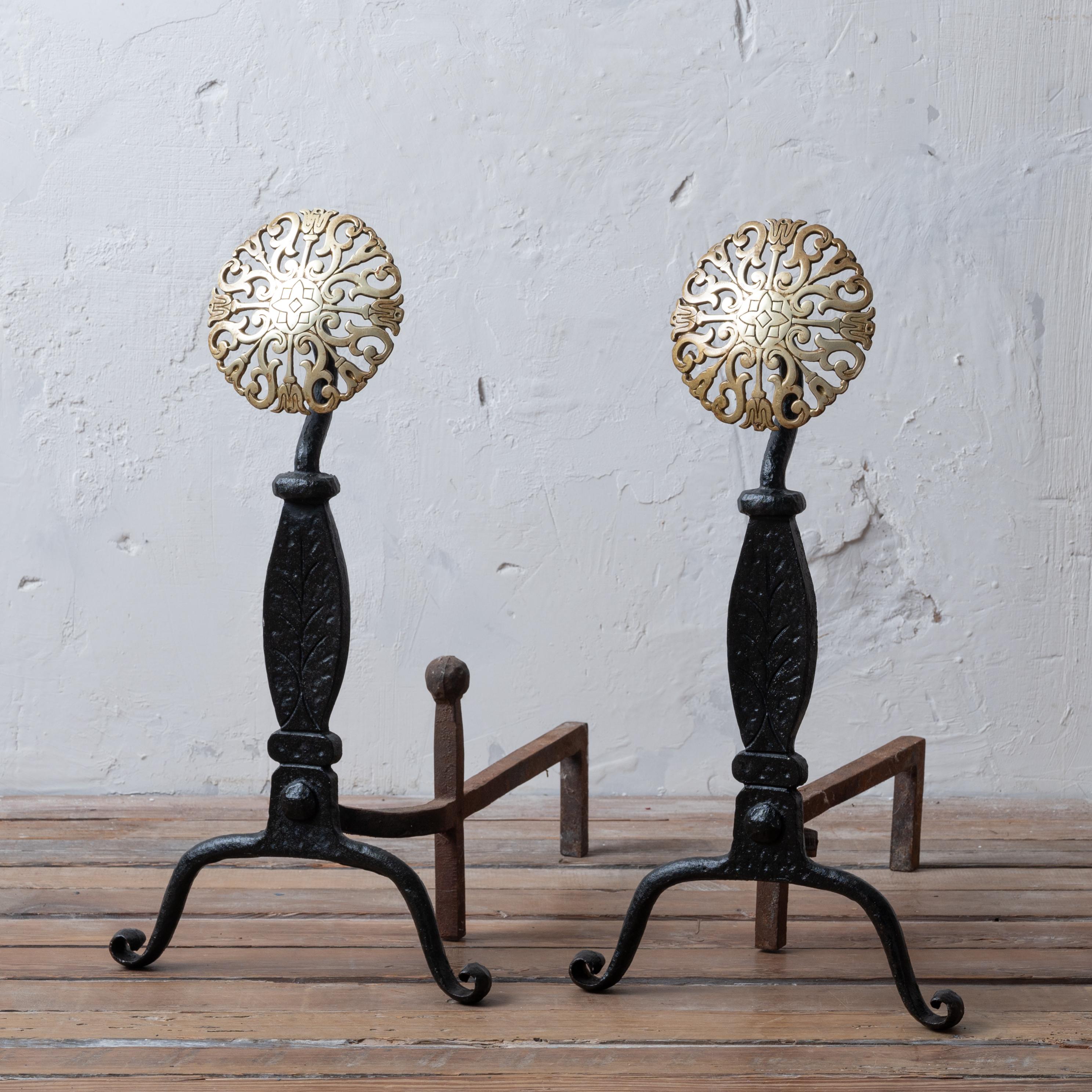 A pair of Virginia Metalcrafters brass medallion andirons, circa 1950s.

12 ½ inches wide by 19 inches deep by 23 ½ inches tall



