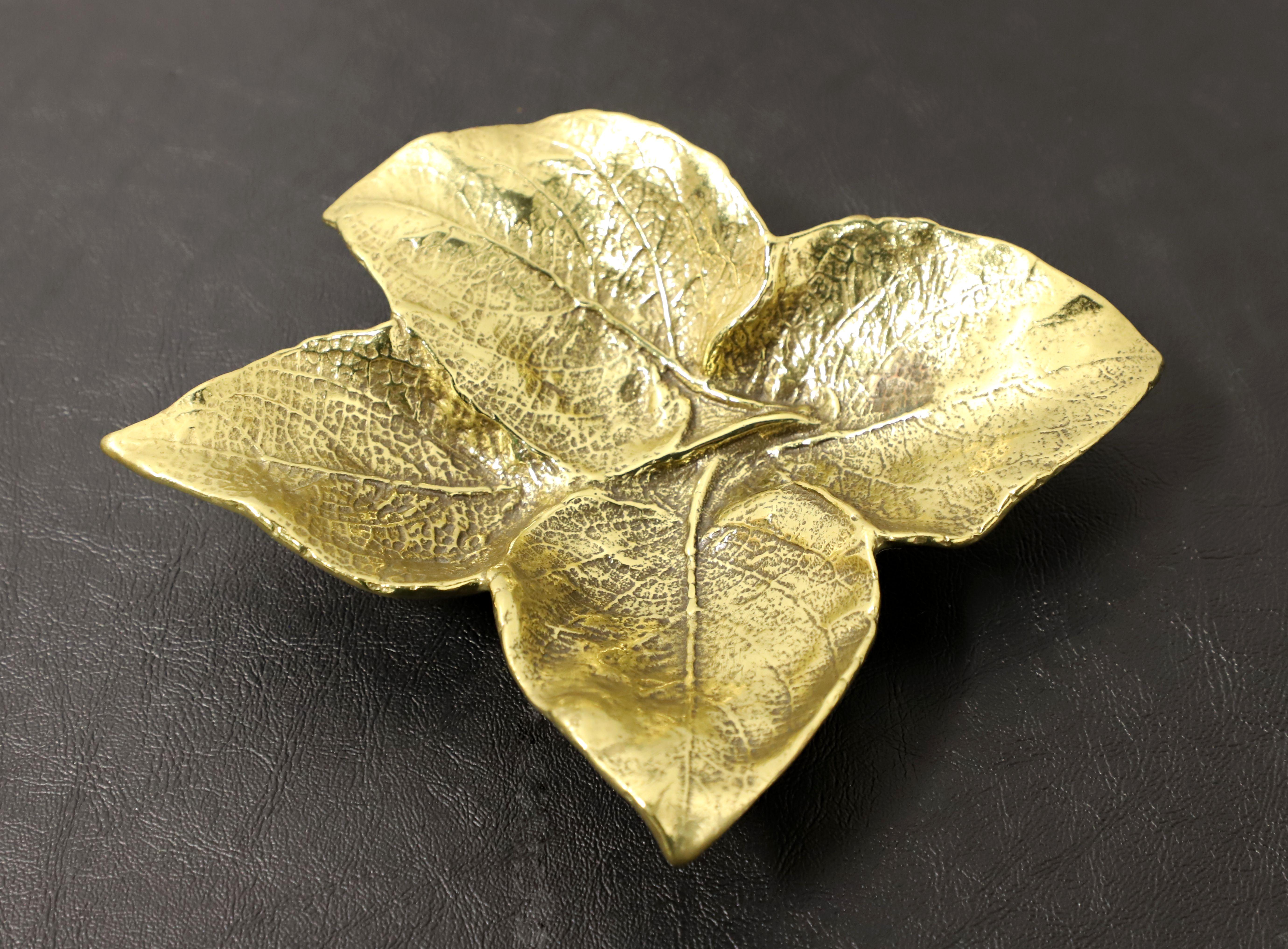 A leaf bowl sculpture by Oskar J Hansen for Virginia Metalcrafters, part of their leaf sculptures collection. Solid brass depicting four leaves of a Coleus plant. Made in Virginia, USA, circa 1963.

Style #:  4-33

Measures: 8.5w 7d 1.5h, Weighs