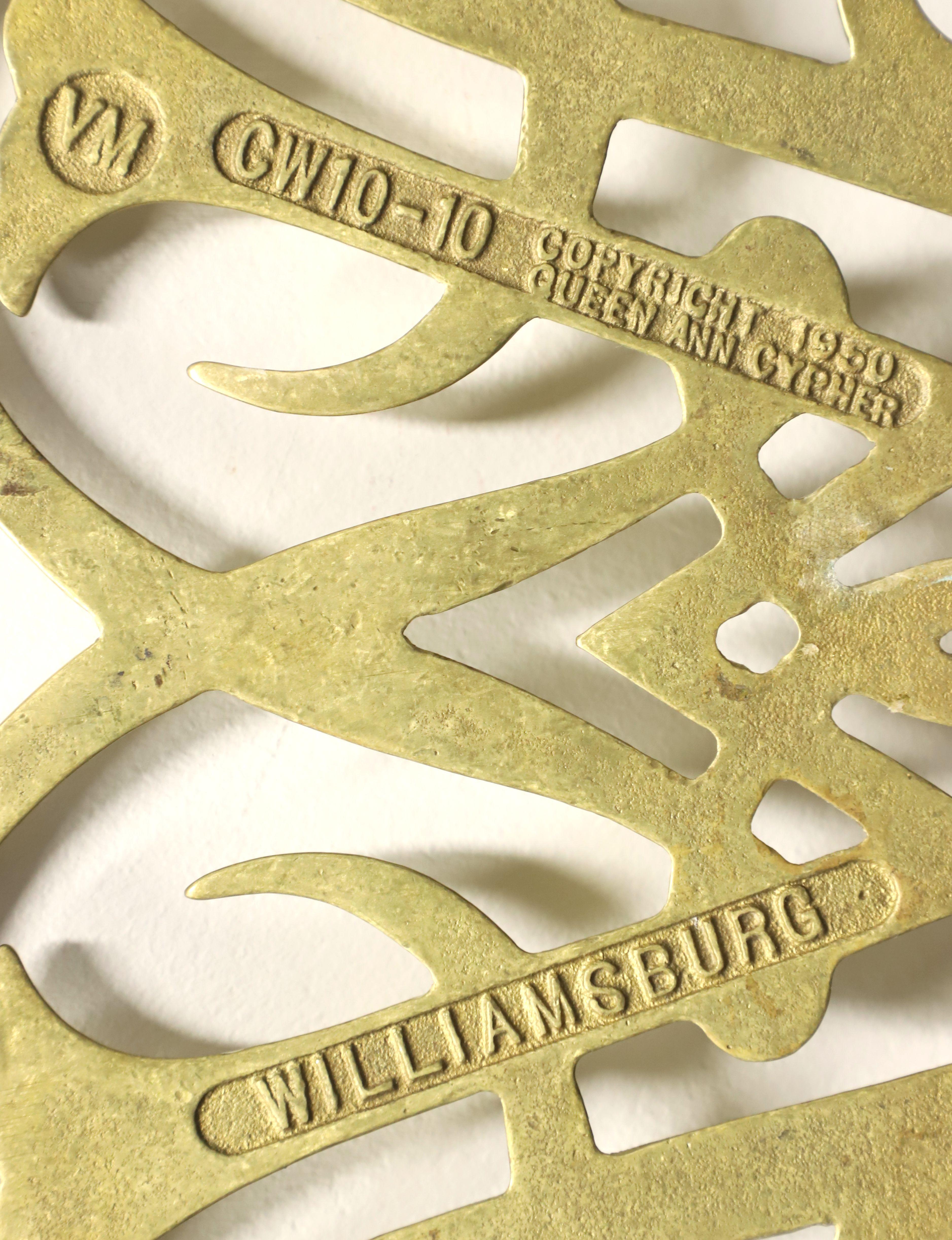 VIRGINIA METALCRAFTERS Brass Williamsburg Queen Anne Cypher Trivets - Pair In Good Condition For Sale In Charlotte, NC