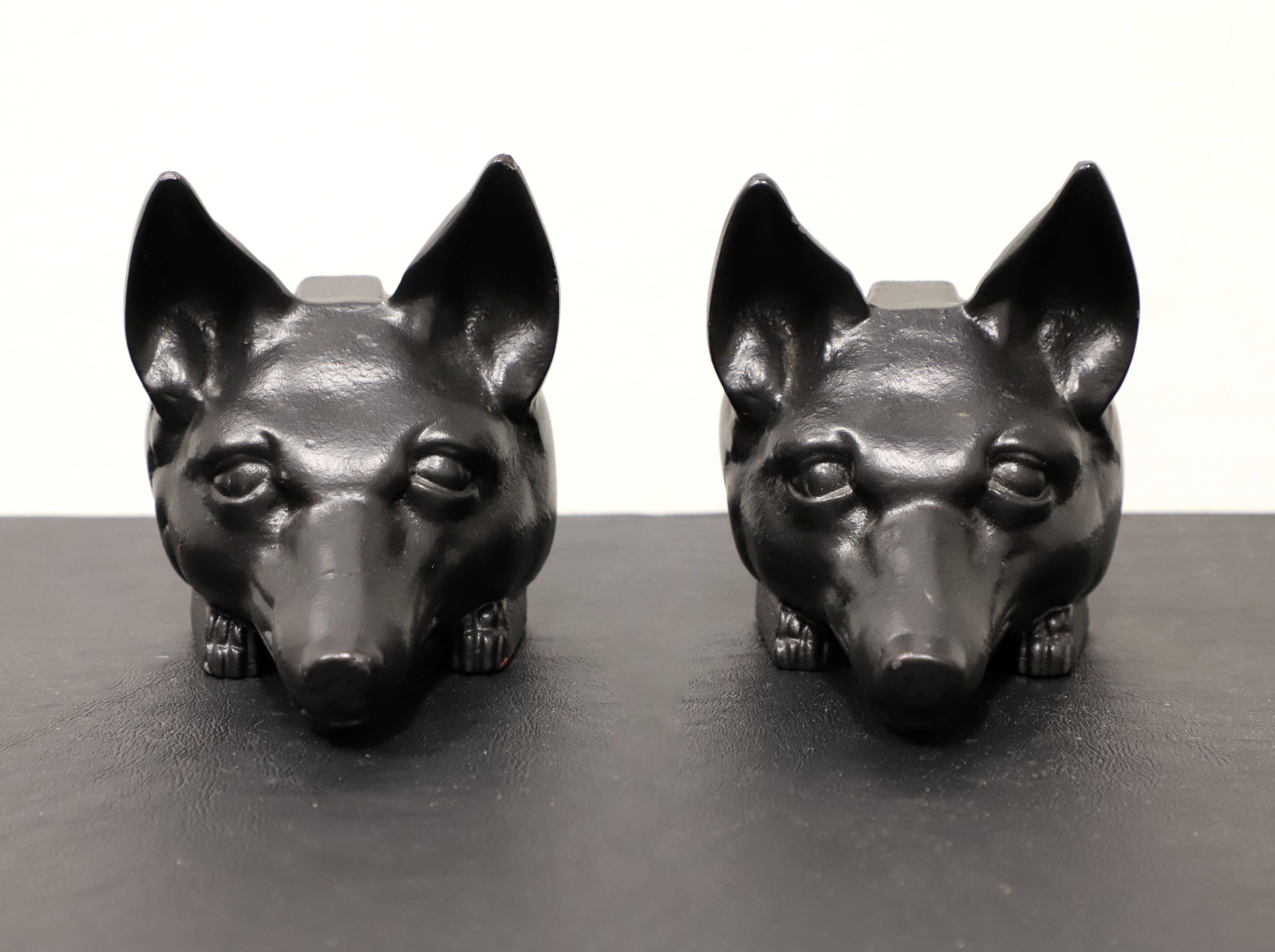 A pair of Late 20th Century bookends by Virginia Metalcrafters. Black color cast iron depicting fox heads. Could alternatively be used as doorstops. Made in Virginia, USA.

Measures: 5.5w 4.75d 6.5h (Each), Weighs Approximately:  4 lbs