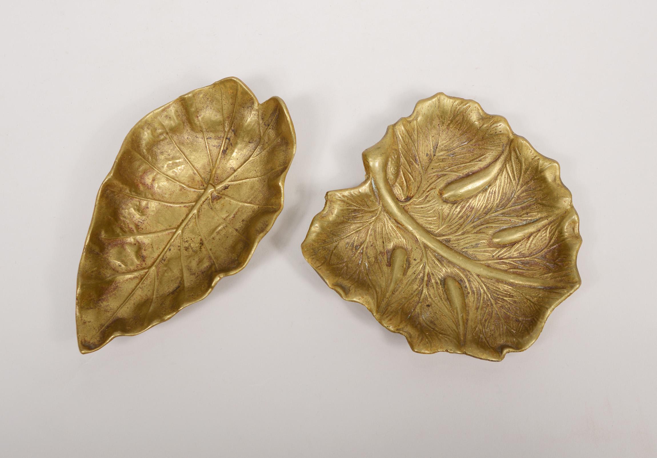 Two leaf trays designed by Oskar J.W. Hansen in 1948 for Virginia Metalcrafters. These are an imperial tarro leaf and a papaia leaf.