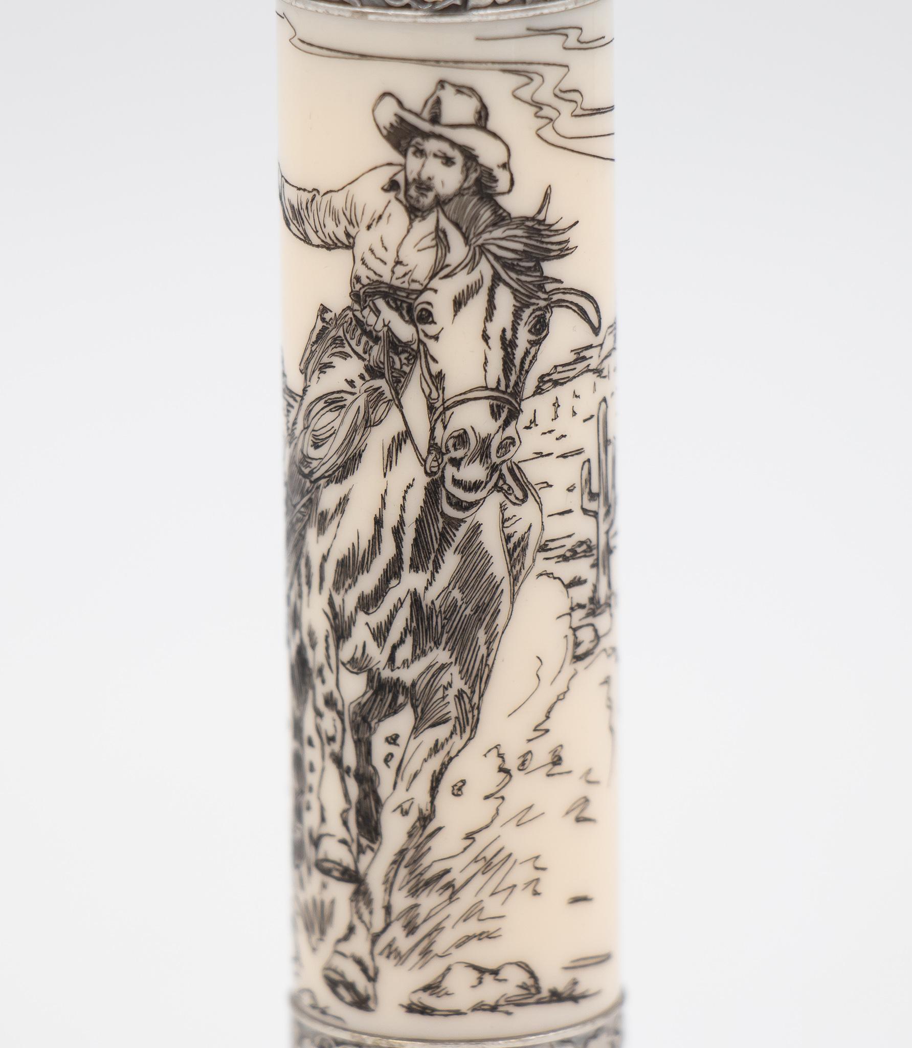 The Wild West writing instrument is crafted from a combination of leather & sterling silver 925. The barrel features an illustration in scrimshaw depicting a cowboy riding a horse. It's packaged in an America walnut wood box which not only encases