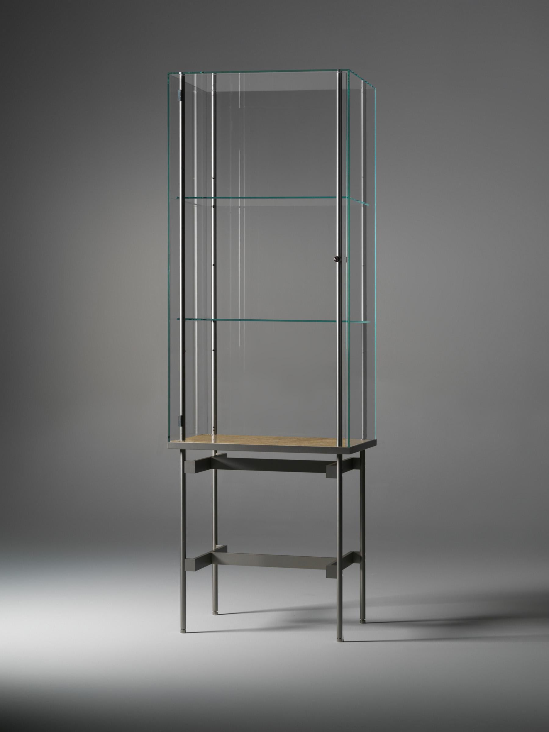 Visibile M Vertical Display Cabinet by Angelo Alinea
Dimensions: W 60 x D 45 x H 181.4 cm 
Material: Display cabinet with marble bottom (honed). Frame in metal, lacquered. Glass cabinet in float glass 6 mm, door in float glass 4 mm.

Also available