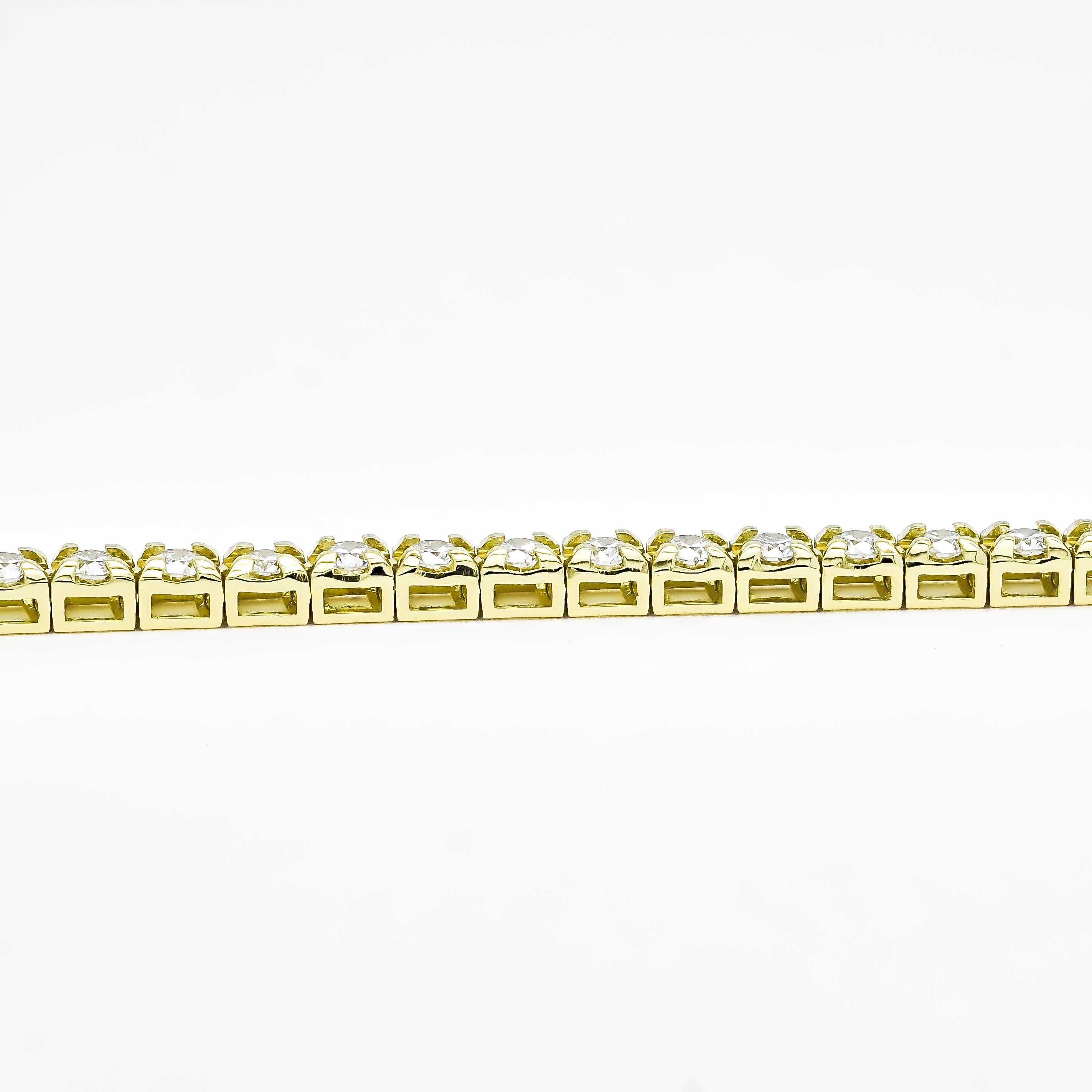 Elevate your style with this exquisite 18K Yellow Gold Four Prong Tennis Bracelet. Crafted with meticulous attention to detail, it features a continuous line of dazzling round-cut natural diamonds, totaling 4.00 carats. Each diamond is expertly