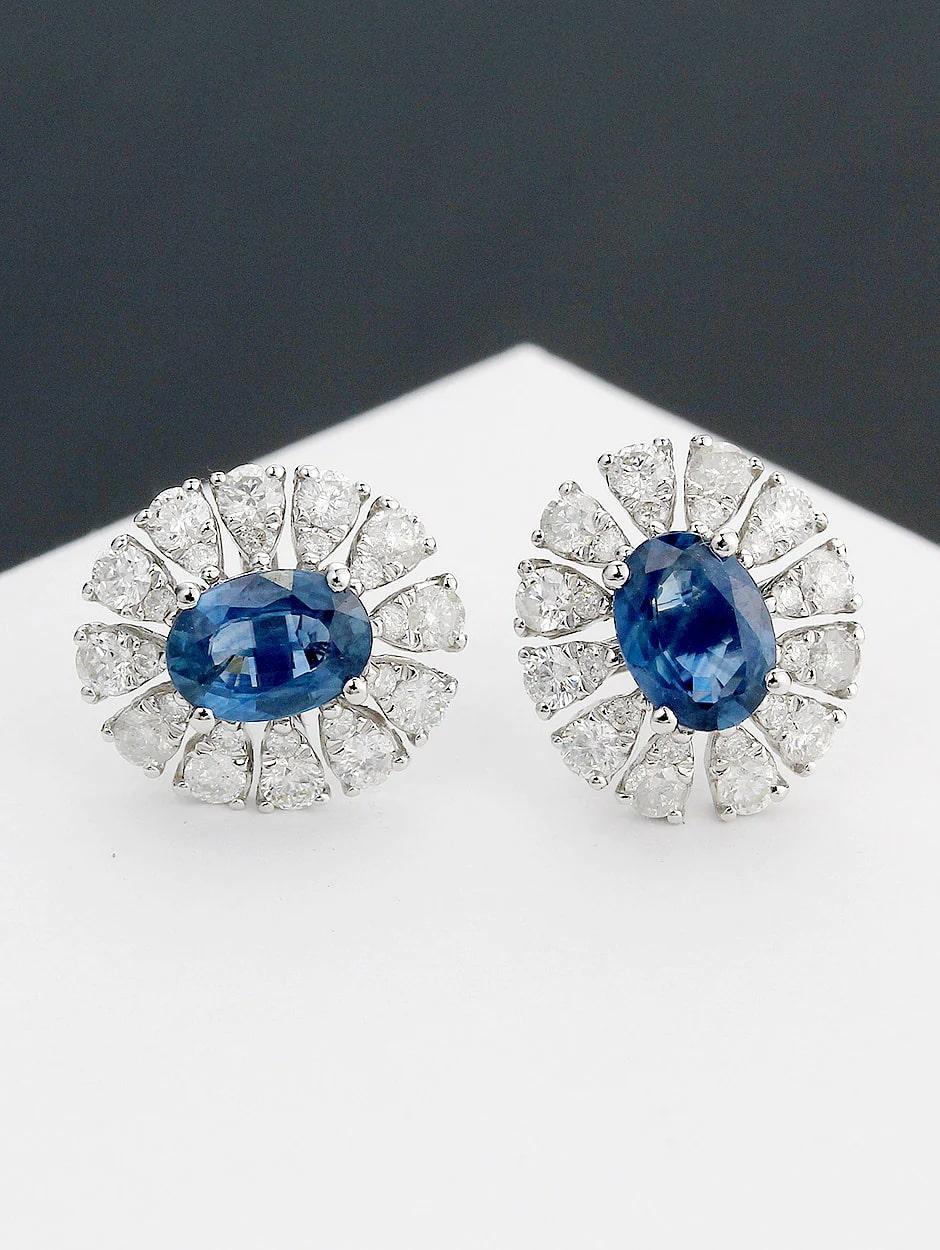 Stud with oval design sapphire earring, all with a high polish finish. Available in 18K White Gold.

Earring Information
Diamond Type : Natural Diamond
Metal : 18K
Metal Color : White Gold
Diamond Carat Weight : 1.16ttcw
Sapphire Carat Weight :