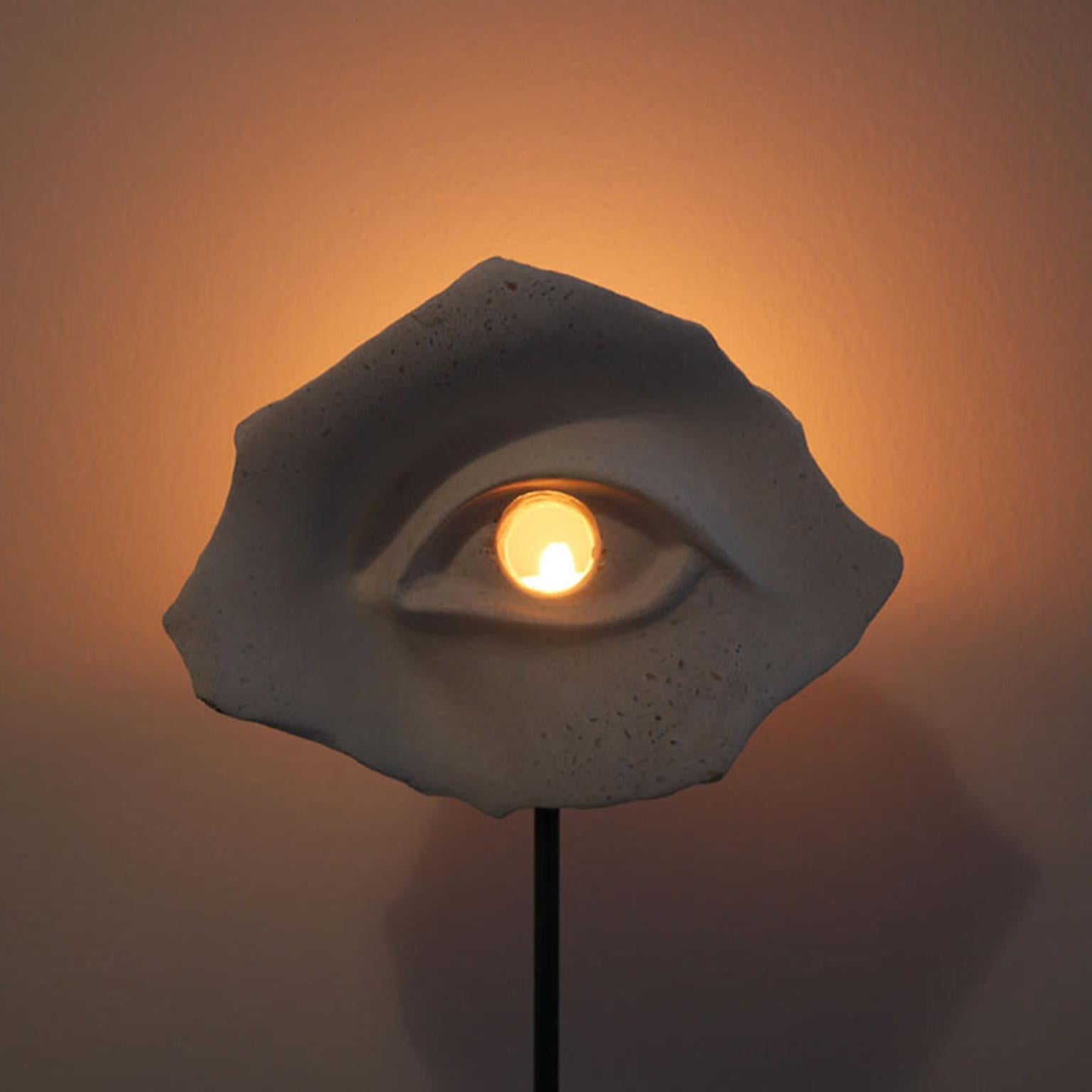 'Vision' sculpted candleholder in limited edition by artist Laurent Pernot. This is presented by French Cliché.
The 'Vision' is a levitating eye on a pedestal. This sculpture is a reference to historical fragments, inspired from those seen in