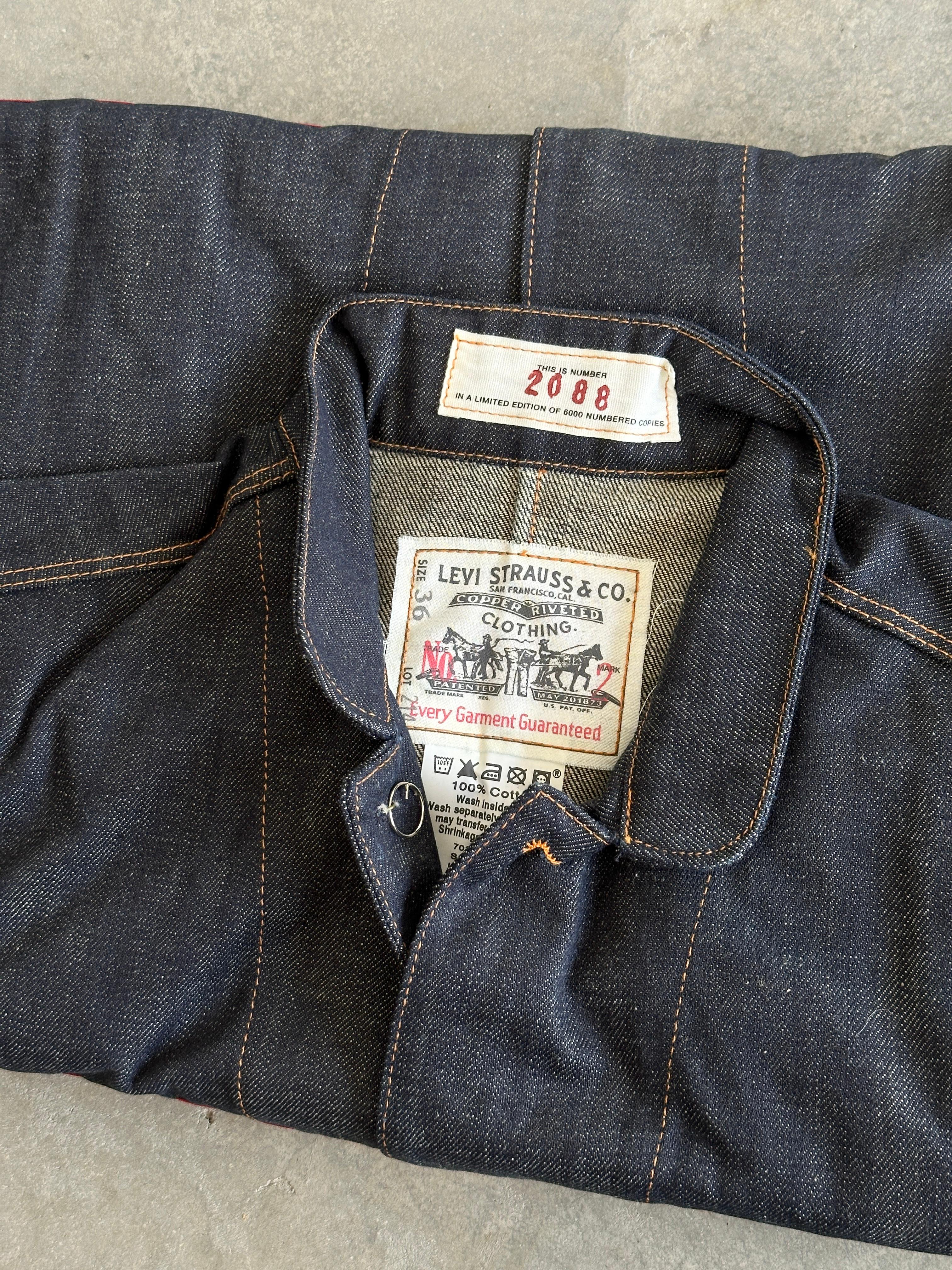 From the Visionaire website:

31 BLUE fulfills two dreams: to make an issue of large-format, poster-size images and to sew the issue into a custom-made garment, in this case, a limited-edition Levi’s turn-of-the-century One-Pocket Sack Coat.