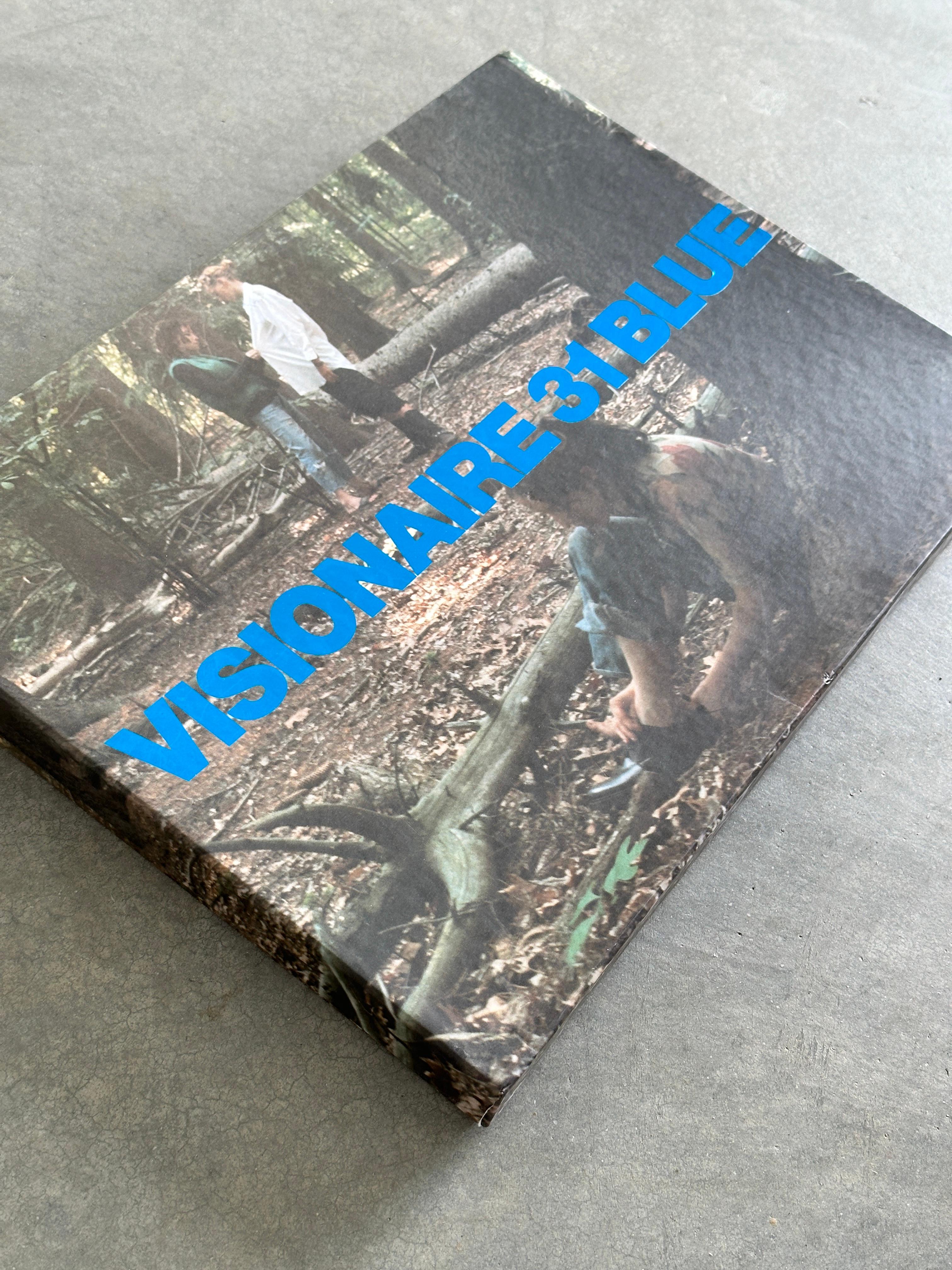 From the Visionaire website:

31 BLUE fulfills two dreams: to make an issue of large-format, poster-size images and to sew the issue into a custom-made garment, in this case, a limited-edition Levi’s turn-of-the-century One-Pocket Sack Coat.