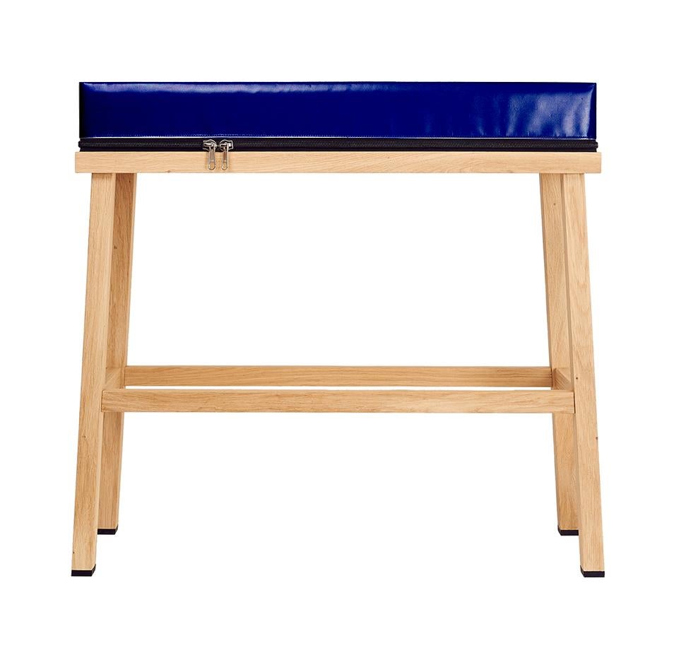 Visser and Meijwaard Truecolors high bench in dark blue PVC cloth with zipper 

Designed by Visser en Meijwaard
Contemporary, Netherlands, 2015
PVC cloth, oakwood, rubber
Measures: H 32 in, W 33.5 in, D 12 in

Cushion can be detached from the