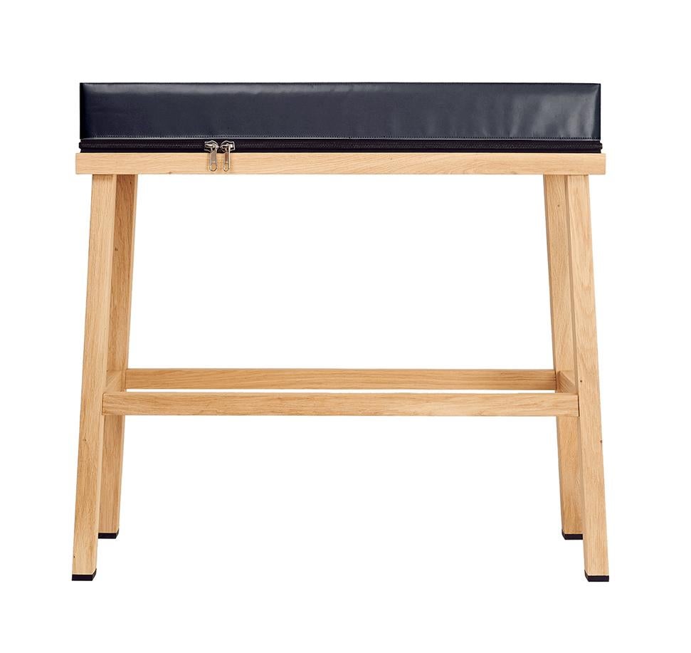 Visser and Meijwaard Truecolors high bench in dark grey PVC cloth with zipper 

Designed by Visser en Meijwaard
Contemporary, Netherlands, 2015
PVC cloth, oakwood, rubber
Measures: H 32 in, W 33.5 in, D 12 in

Cushion can be detached from the