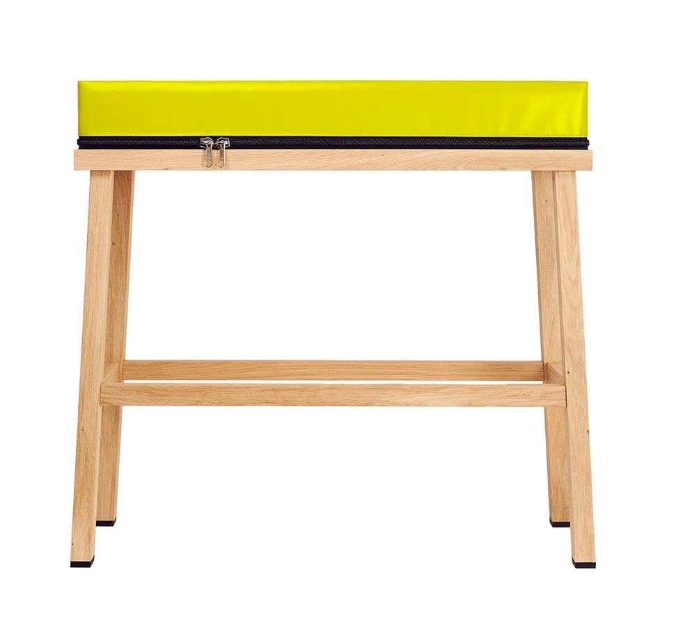 Visser and Meijwaard Truecolors high bench in yellow PVC cloth with zipper 

Designed by Visser en Meijwaard
Contemporary, Netherlands, 2015
PVC cloth, oakwood, rubber
Measures: H 32 in, W 33.5 in, D 12 in

Available in white, blue, dark