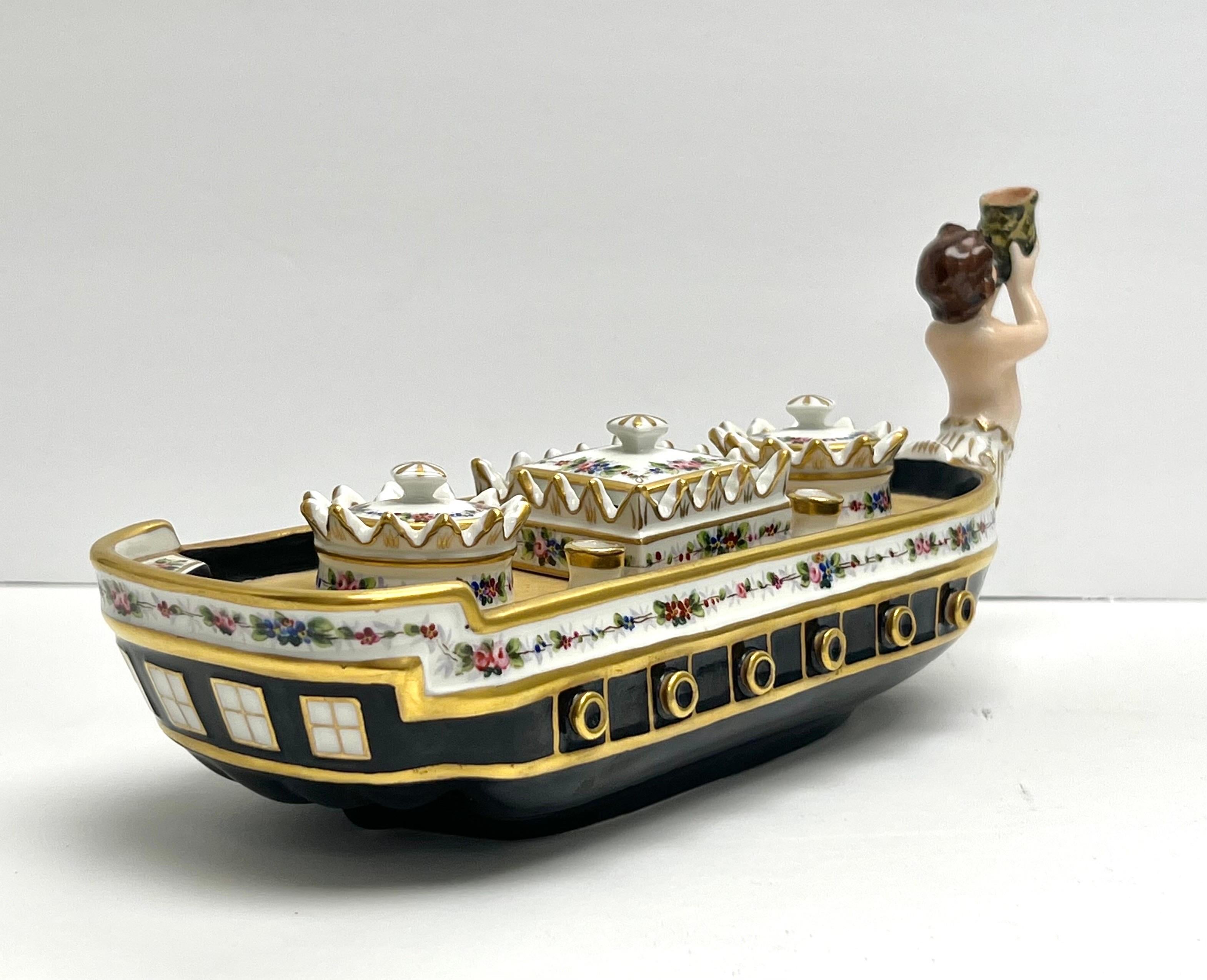 A Vista Alegre Porcelain figurative inkwell. Meticulous detail in the casting and hand painted decoration. Retain all the pieces intact. Circa late 1940s.