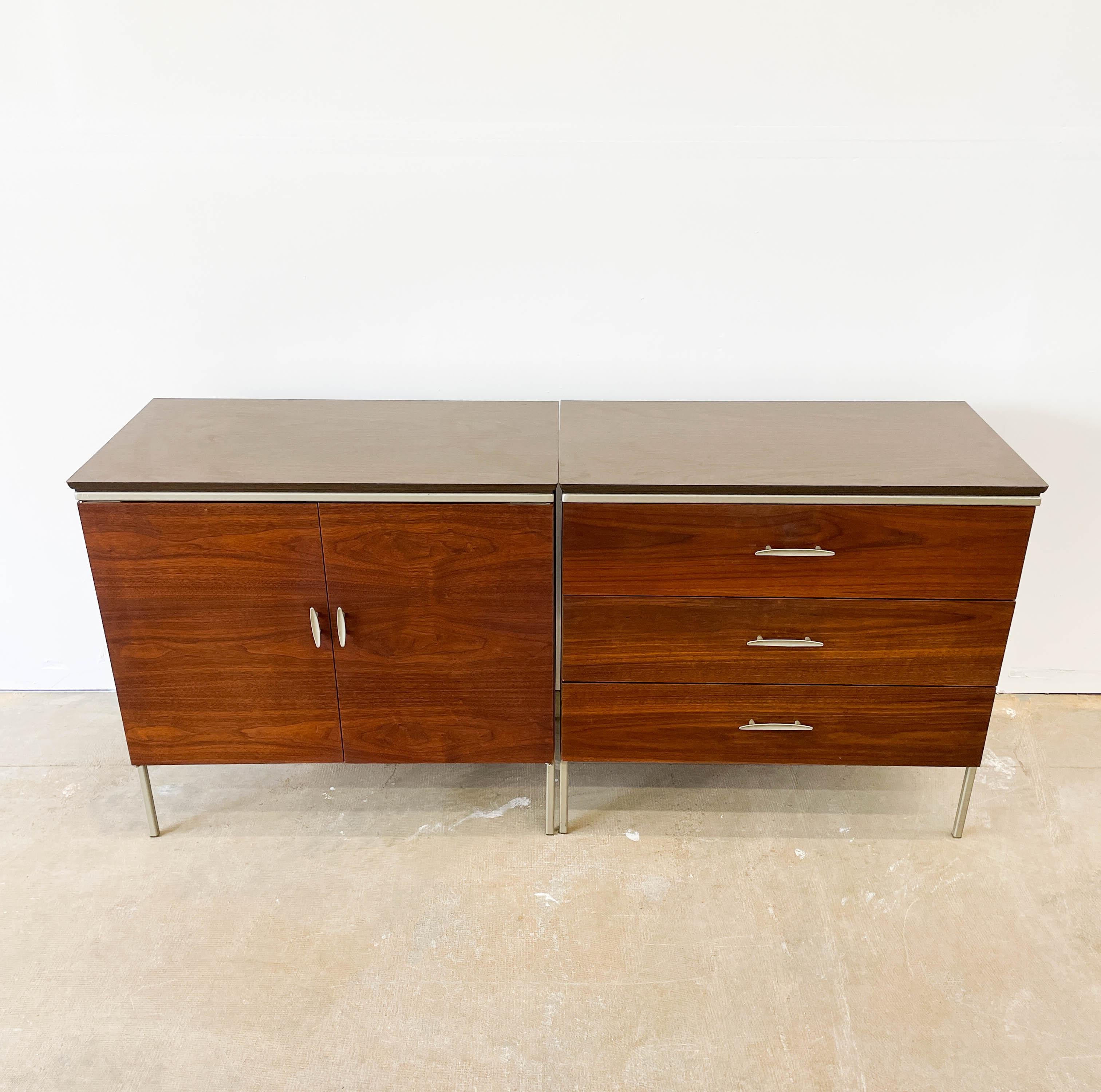 This two-door cabinet from Vista of California is crafted from walnut and boasts a beautiful grain. The piece was designed by Kipp Stewart and Stuart McDougall for Vista of California and dates back to the 1950s. A felt-lined drawer offers