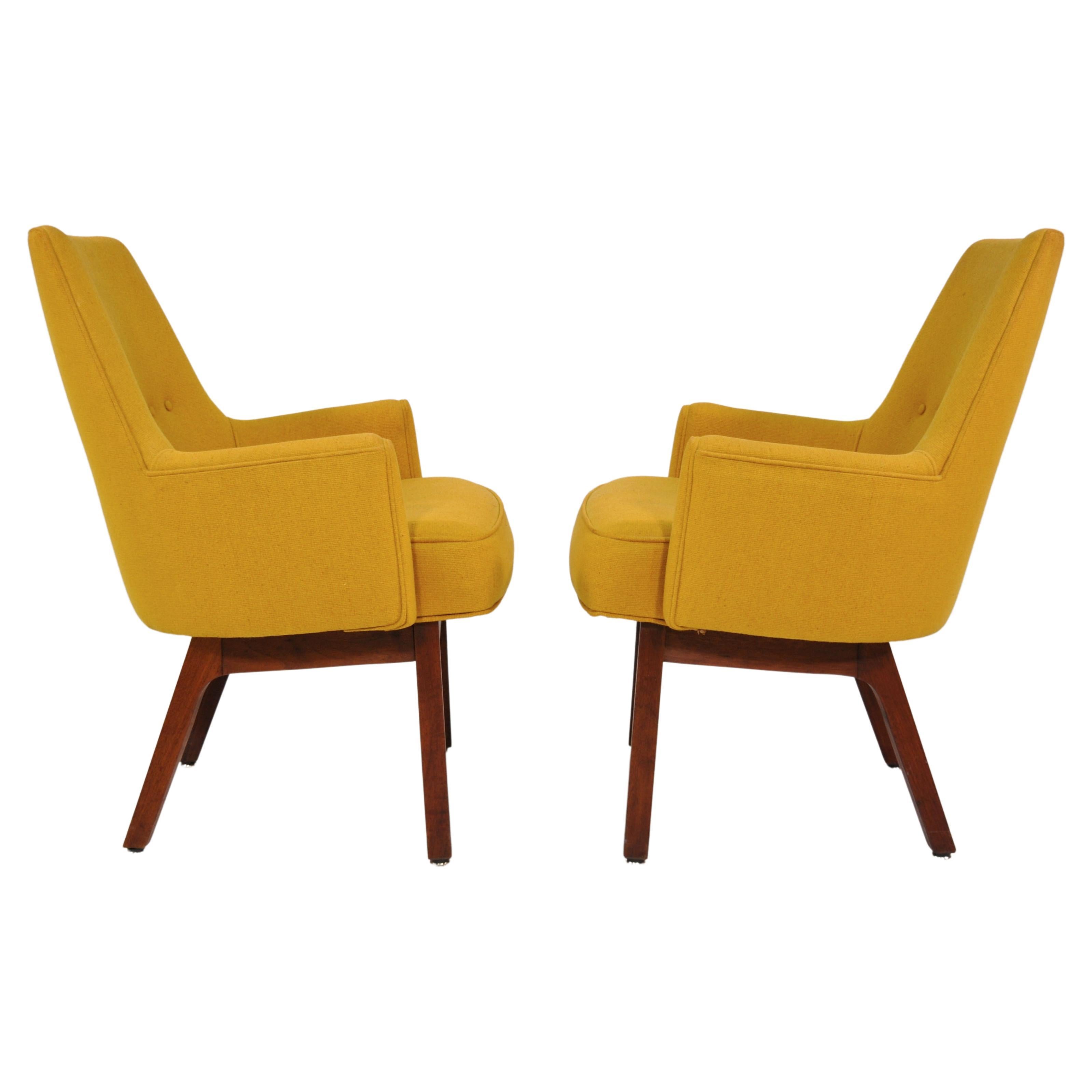 Rare pair of vintage walnut tufted armchairs by Vista of California in all original condition. The Mid-Century Modern lounge chairs feature: original warm yellow wool upholstery; bucket style seats; tapered backrest with button tufting; label. These