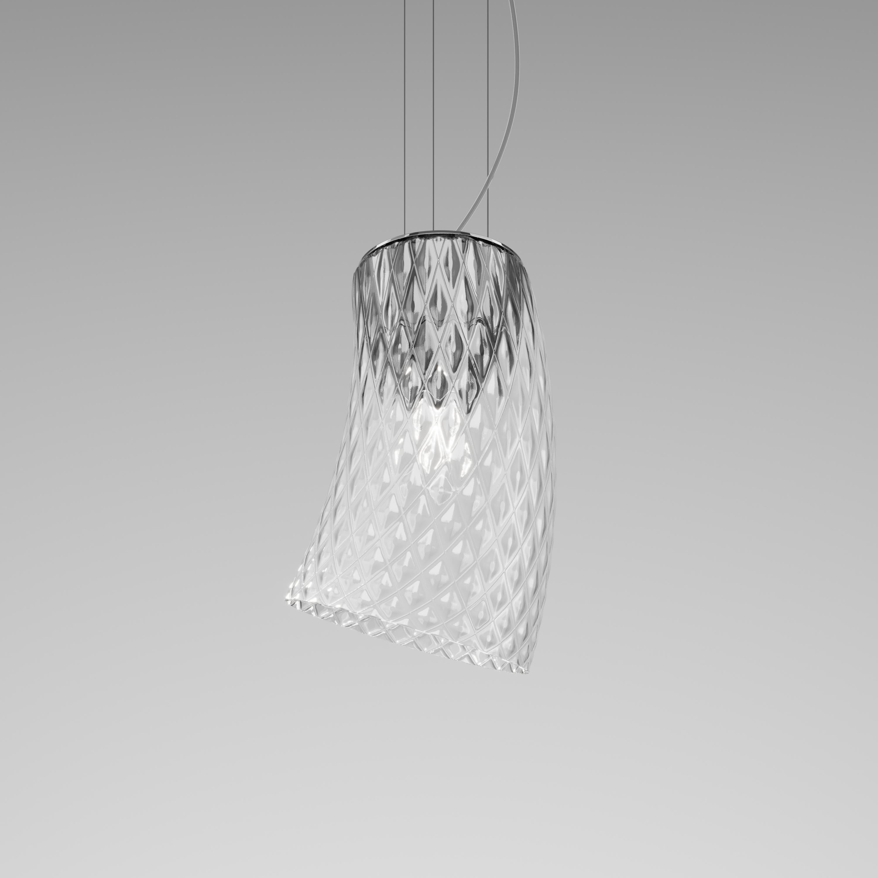 The collection is composed of two glass cylinders available in white or transparent “balloton” crystal. The two elements are rotating and can be oriented in different directions, thus allowing always different and unique