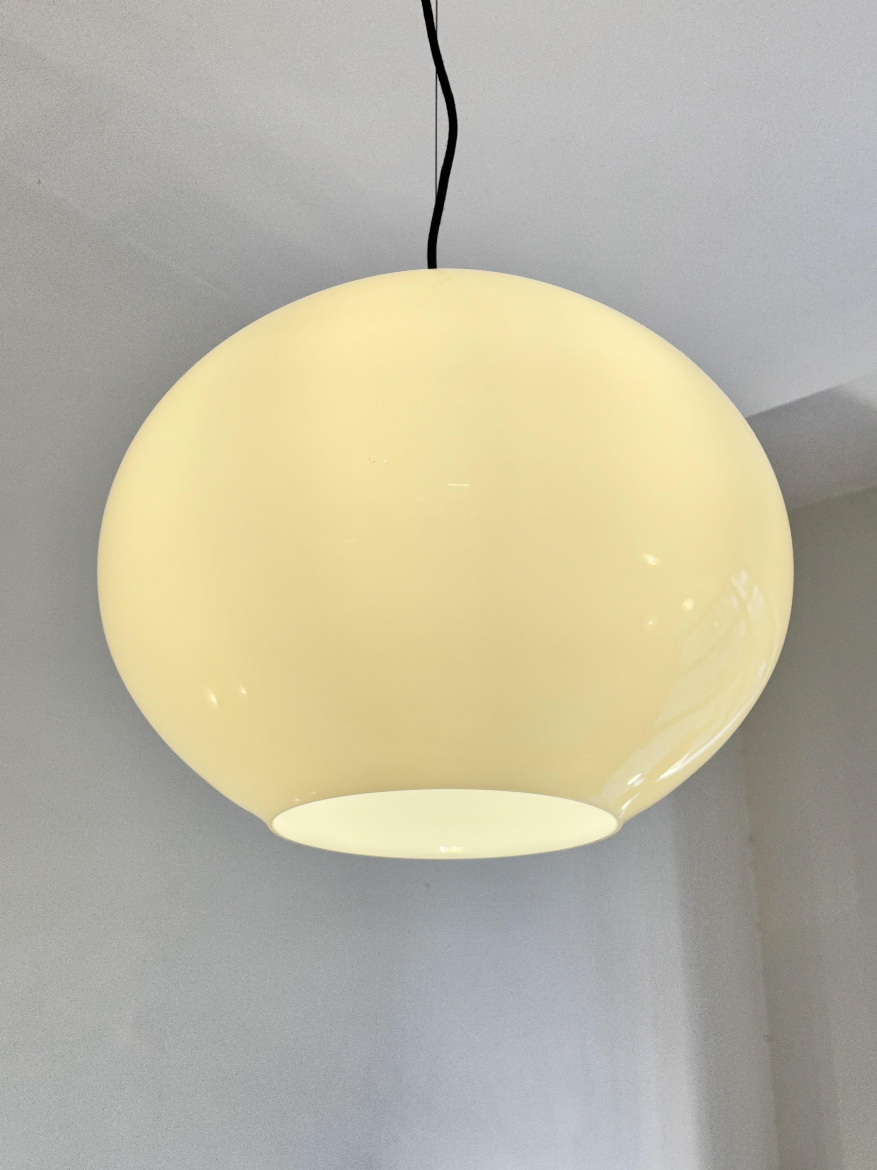 Italian ambar white opaline glassI pendant light by Vistosi.The blown glass gives light its central role.directing it to the environment and emphasizing the brightness.LED lighting source.