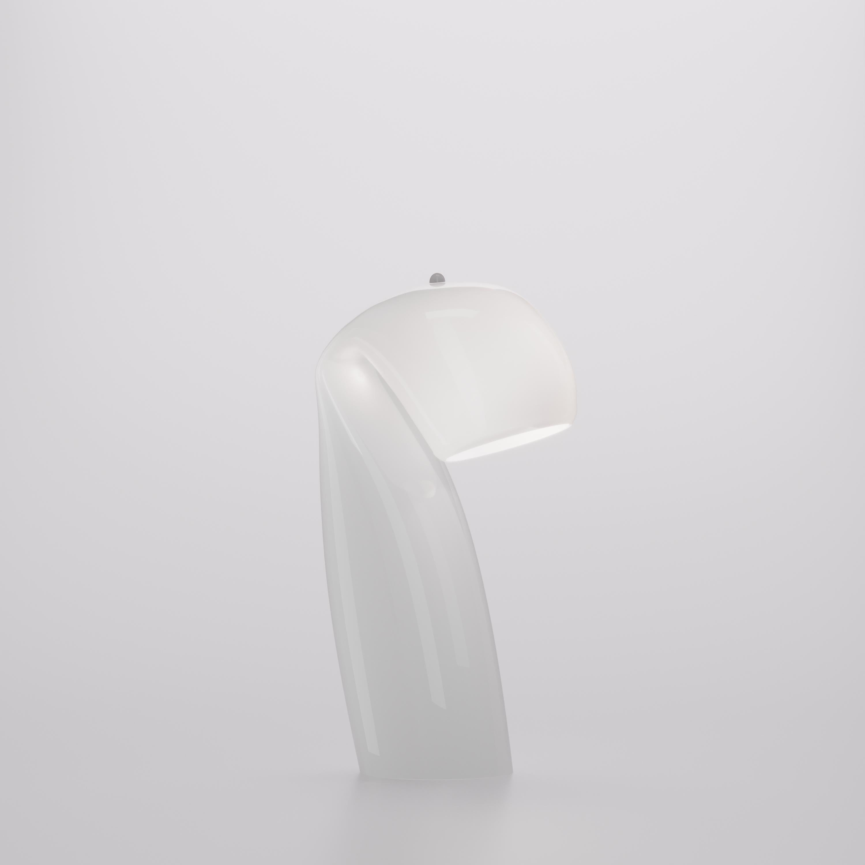 Reflecting the simplicity of vintage design, the Bissa table lamp has high-quality glass and a unique character that complements its handmade production. Glass color tone in glossy white. Metal parts in white. G9 lighting.

 
