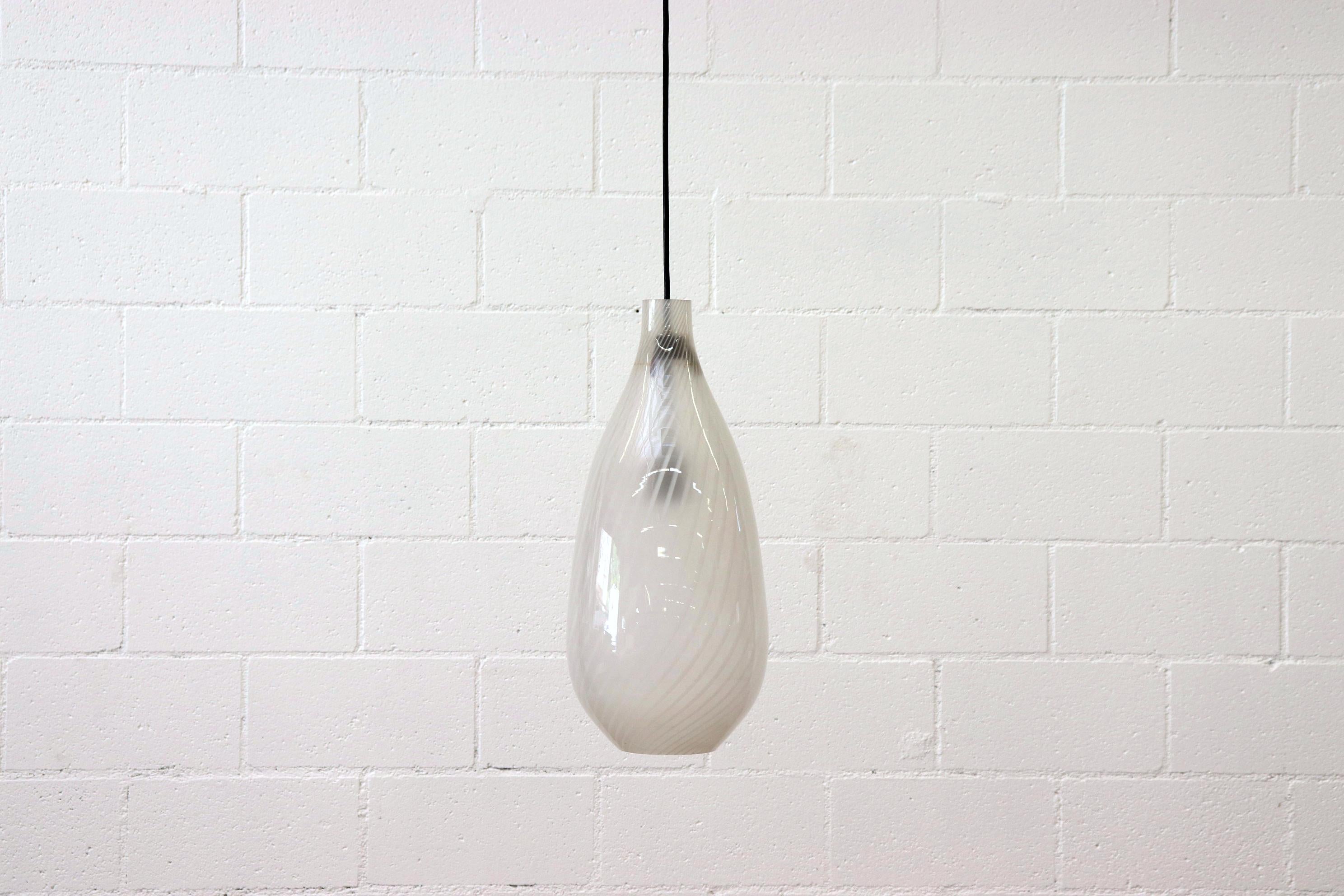 Italian hand blown glass pendant lamp with white stripe Swirls. Tear drop shaped glass shade suspended on a hanging socket with standard bulb. In original condition.