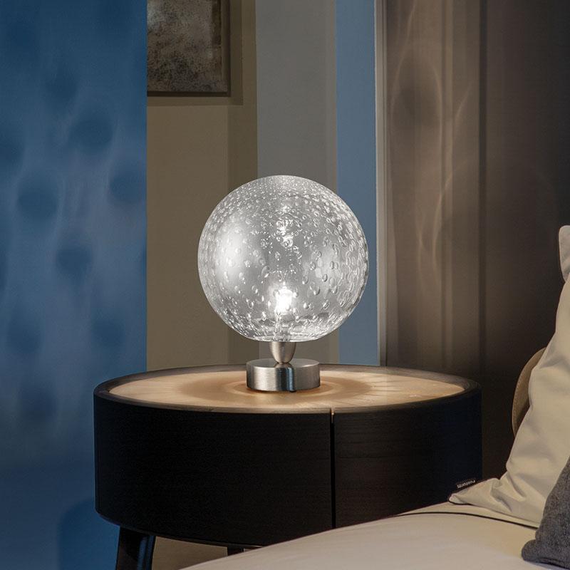 The main characteristic of this collection of lamps produced with the balloton technique is the insertion of bubbles of air in the glass during its production, that create multiple reflections and add an organic texture on the surface of the sphere.