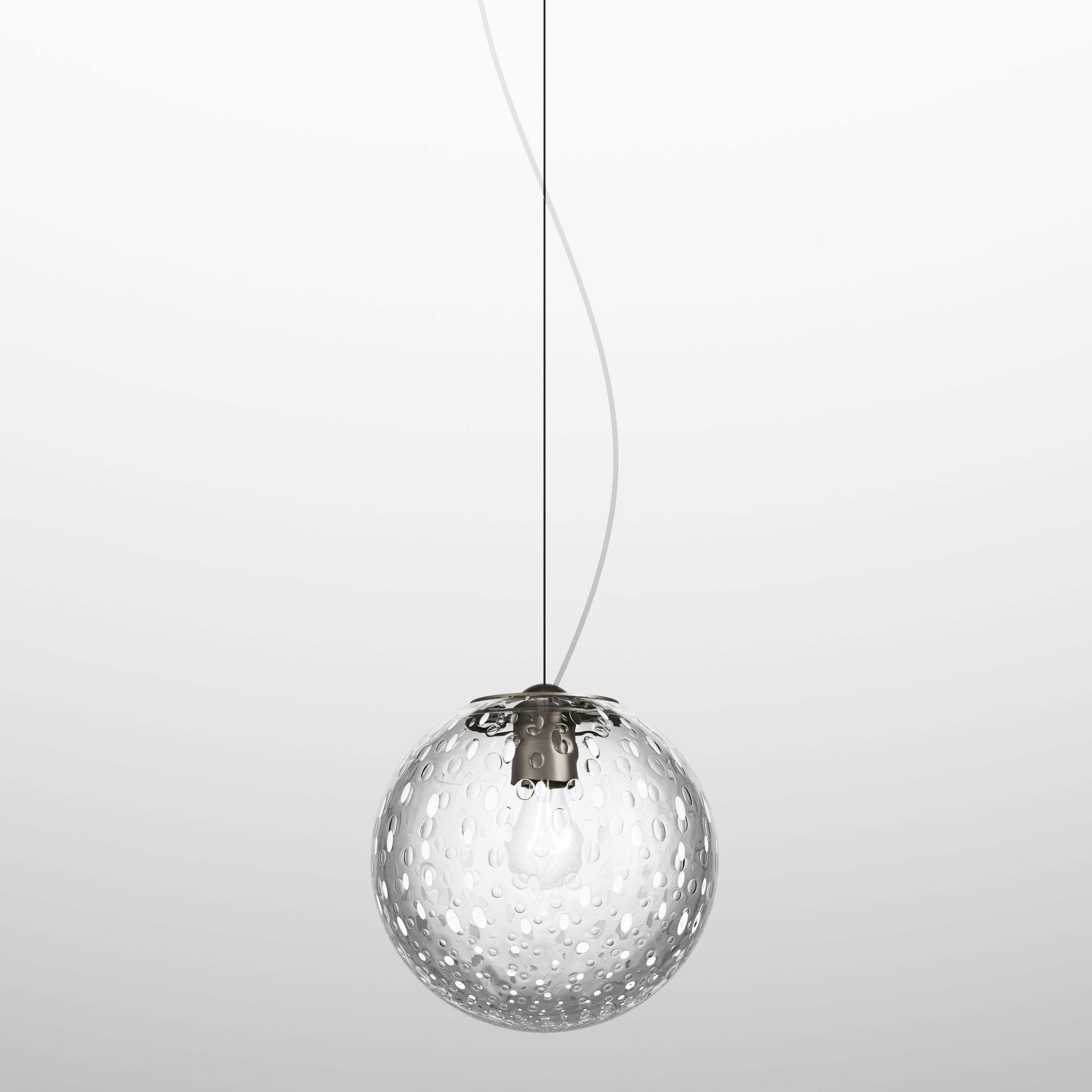 Small sized ceiling pendant representing the Bolle collection characterized by the baloton technique and the insertion of glass air bubbles during production in white satin. The baloton technique creates multiple reflections and adds an organic