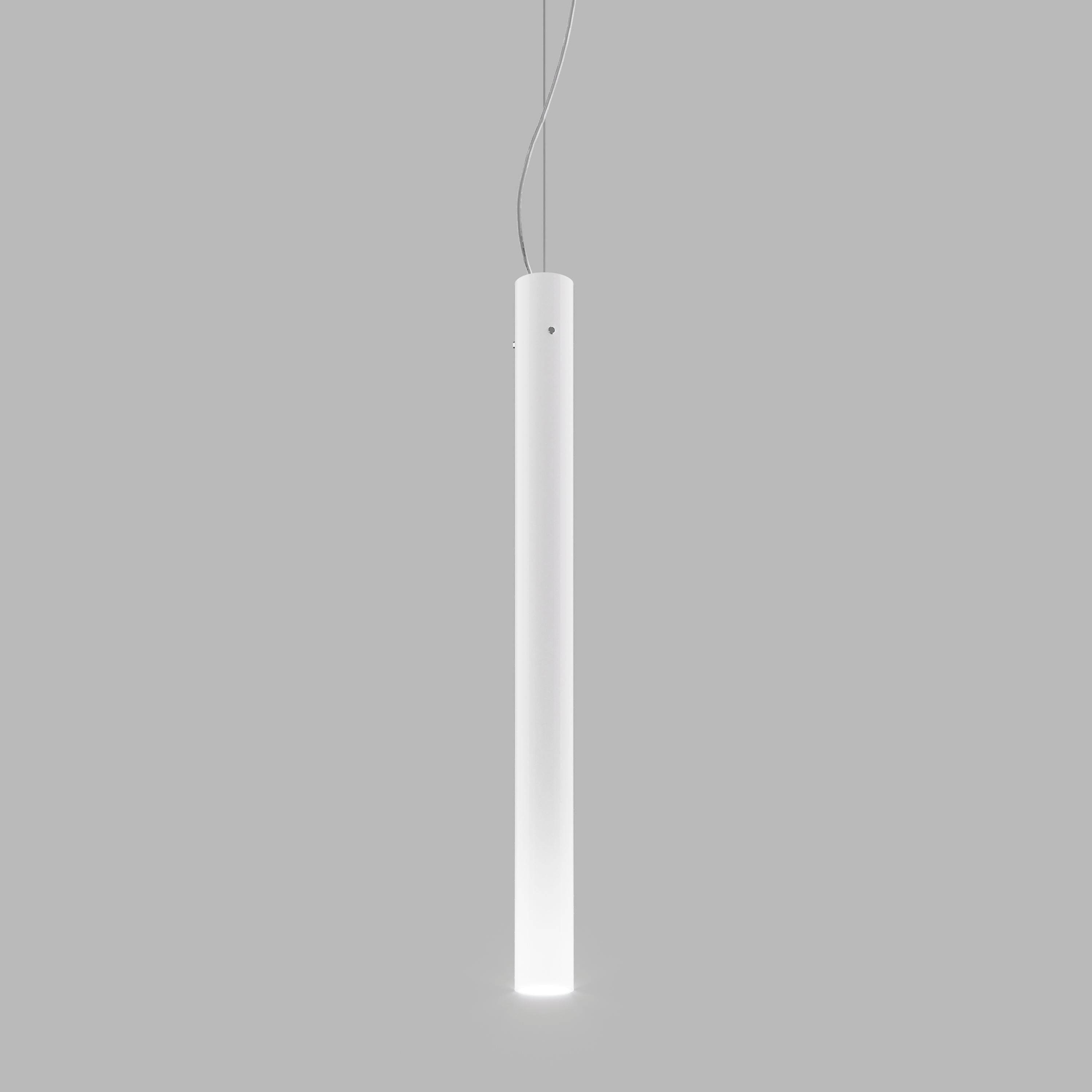 A pendant made with blown cased glass. Due to its narrow diameter a good deal of skill is necessary to blow a piece of it with even thickness. 

Light source: 1x60W G9.