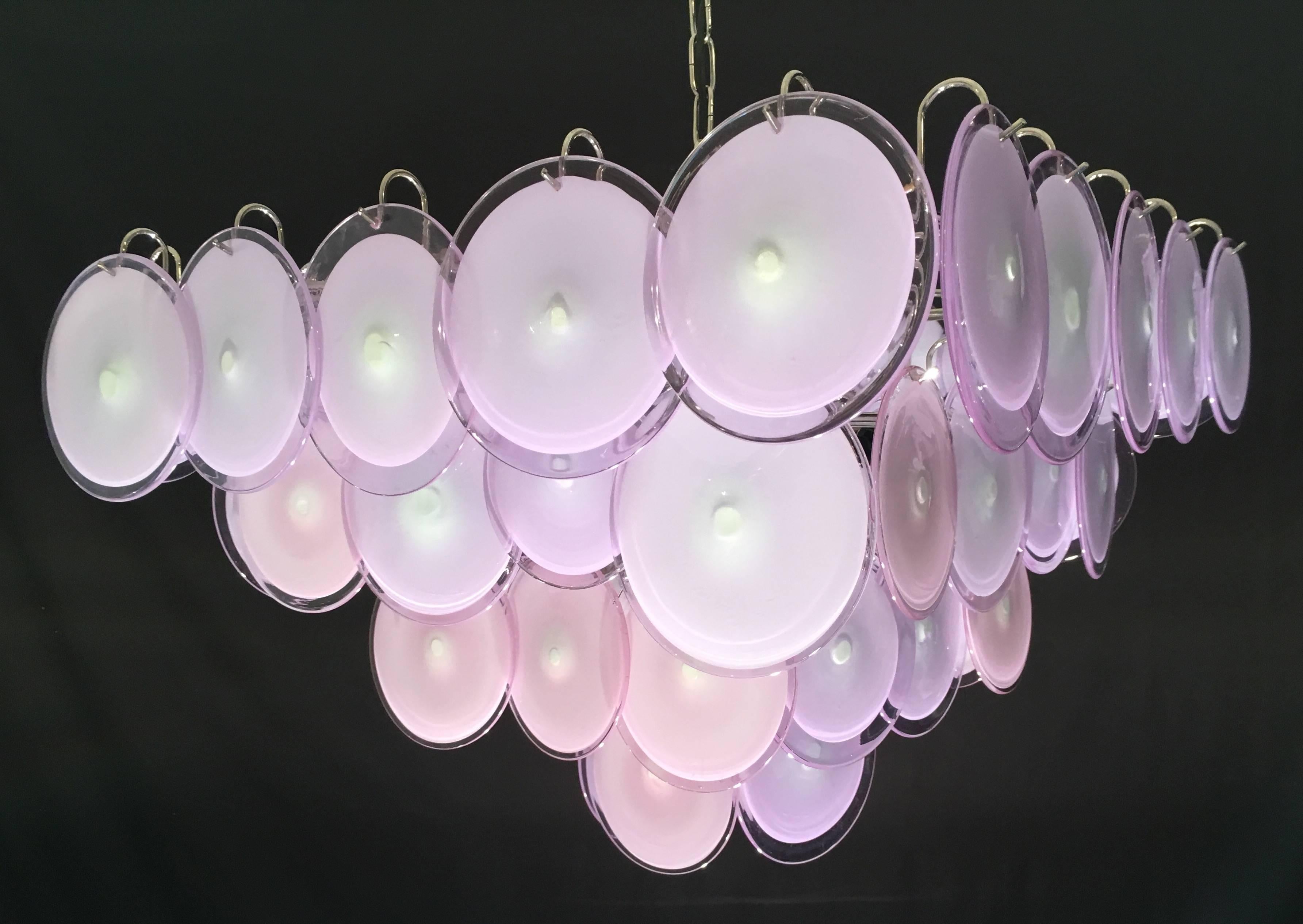 Each chandelier is made of 50 discs of precious Murano glass are arranged on four levels.
 Nine light bulbs E 14.
