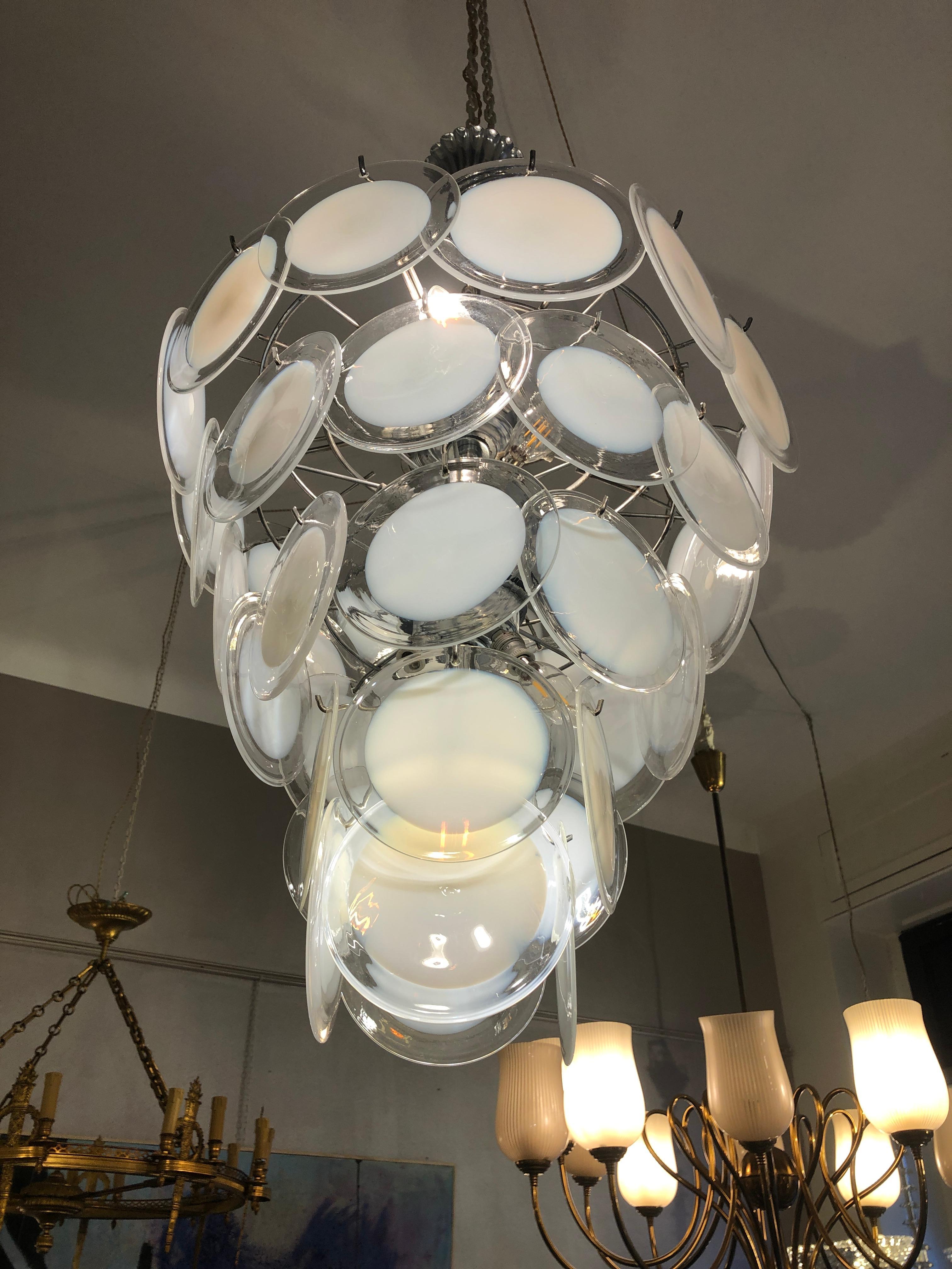 Vistosi for Venini chandelier, 10 lights
The Chandeliers features rounded disks hanged on 
Electric wiring system checked, ready to be used.
Size: diameter 40 cm, height 100 cm in total.
It will be delivered disassembled, do not worry