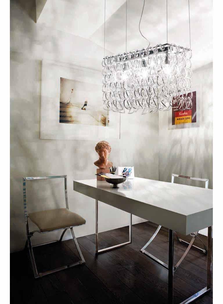Pendant light based on a single element: the handmade glass link. E26 lighting. Dimensions are in reference to the light fixture and not inclusive of the hanging length.
 
