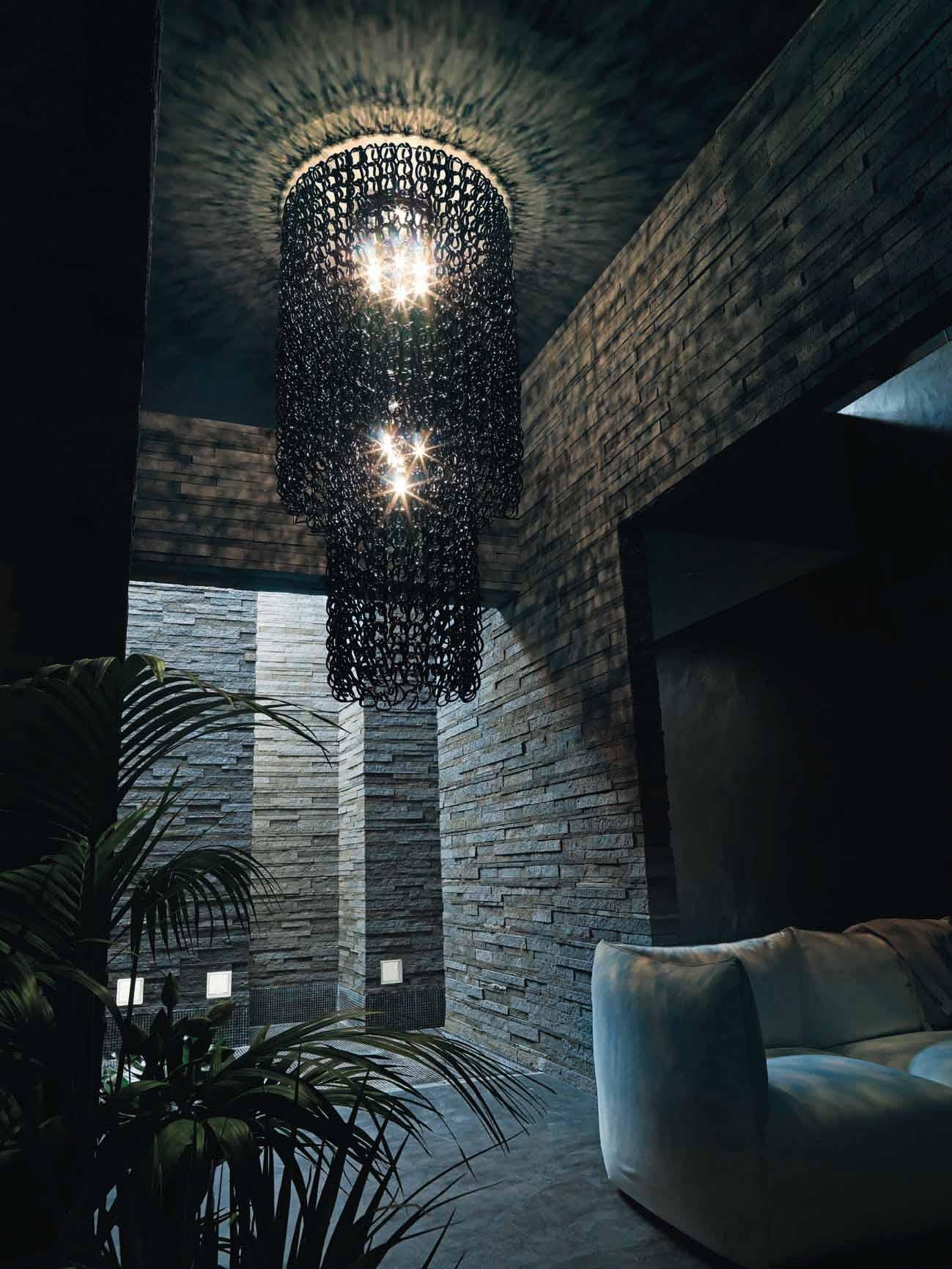 The Giogali collection is a decorative lighting system based on a single element: the handmade glass link. Featured cascade chandelier in crystal. Metal parts in chrome. E26 lighting.
  