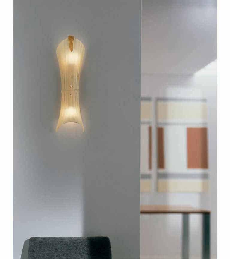 Wall sconce with an unconventionally shaped blown glass fixture made from traditional 'rigadin' technique and a warm silk color with 24-karat gold flakes. E12 lighting.
    