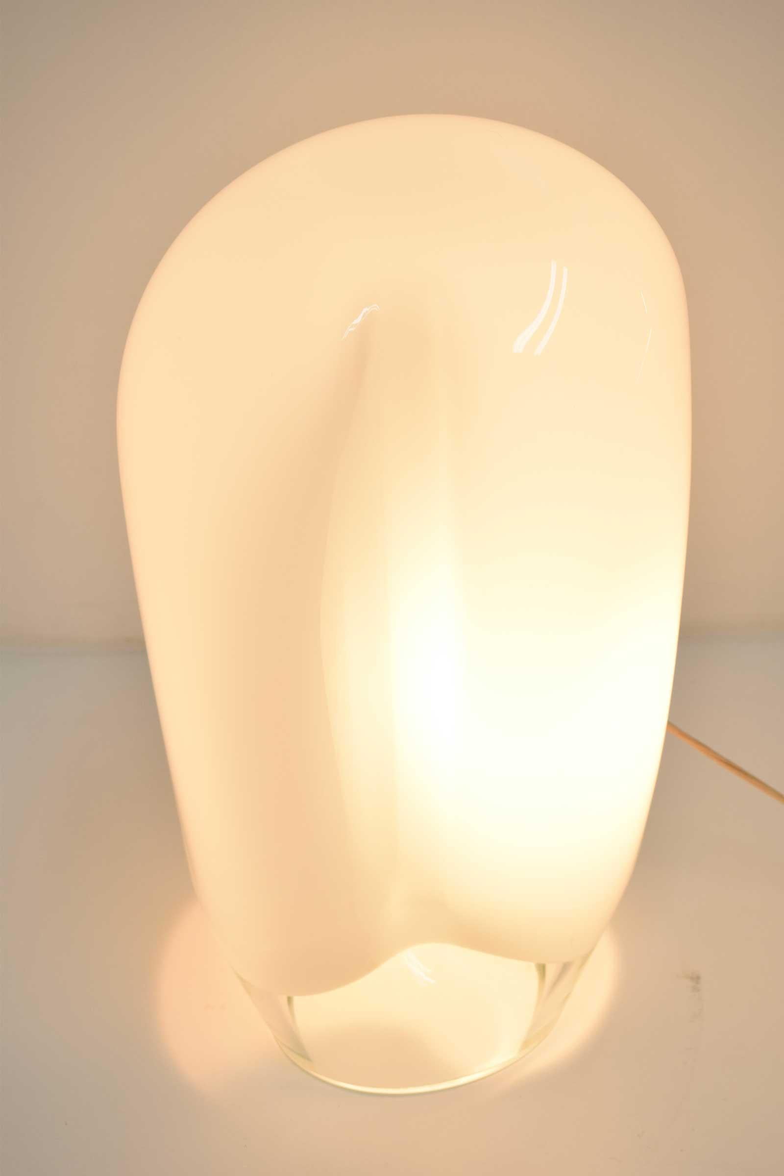Great mood lighting, beautiful Vistosi table lamp.