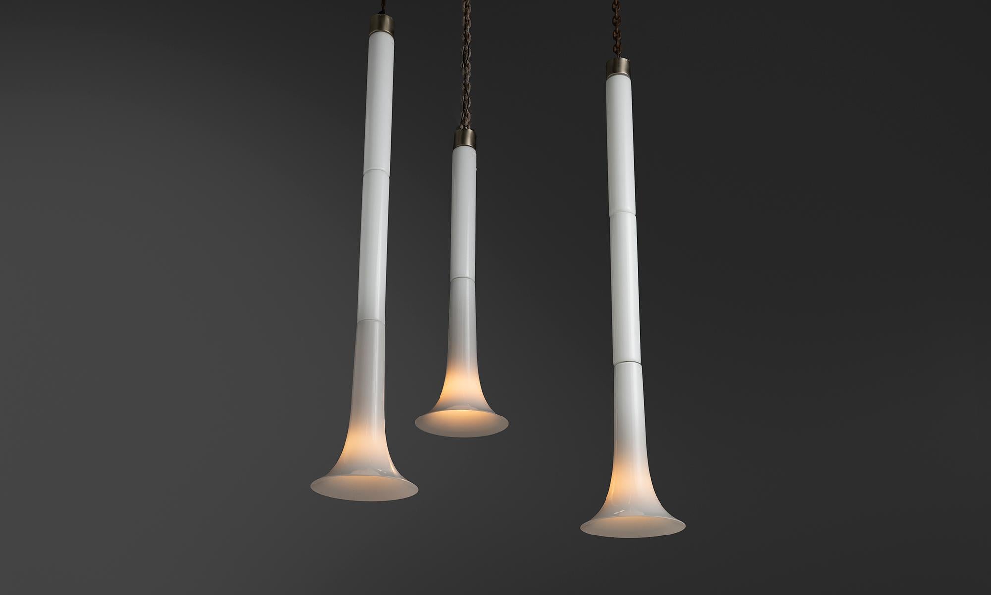 Italy, 1970
Opaline glass and solid steel flute shaped tube pendants by Vistosi. One of the larger lights has small chip on shade (noted in pictures).
11.5”dia x (1) 40.75”h x (2) 60”h
Ref. L5211
$ 3,200 ea ( 3 avail )