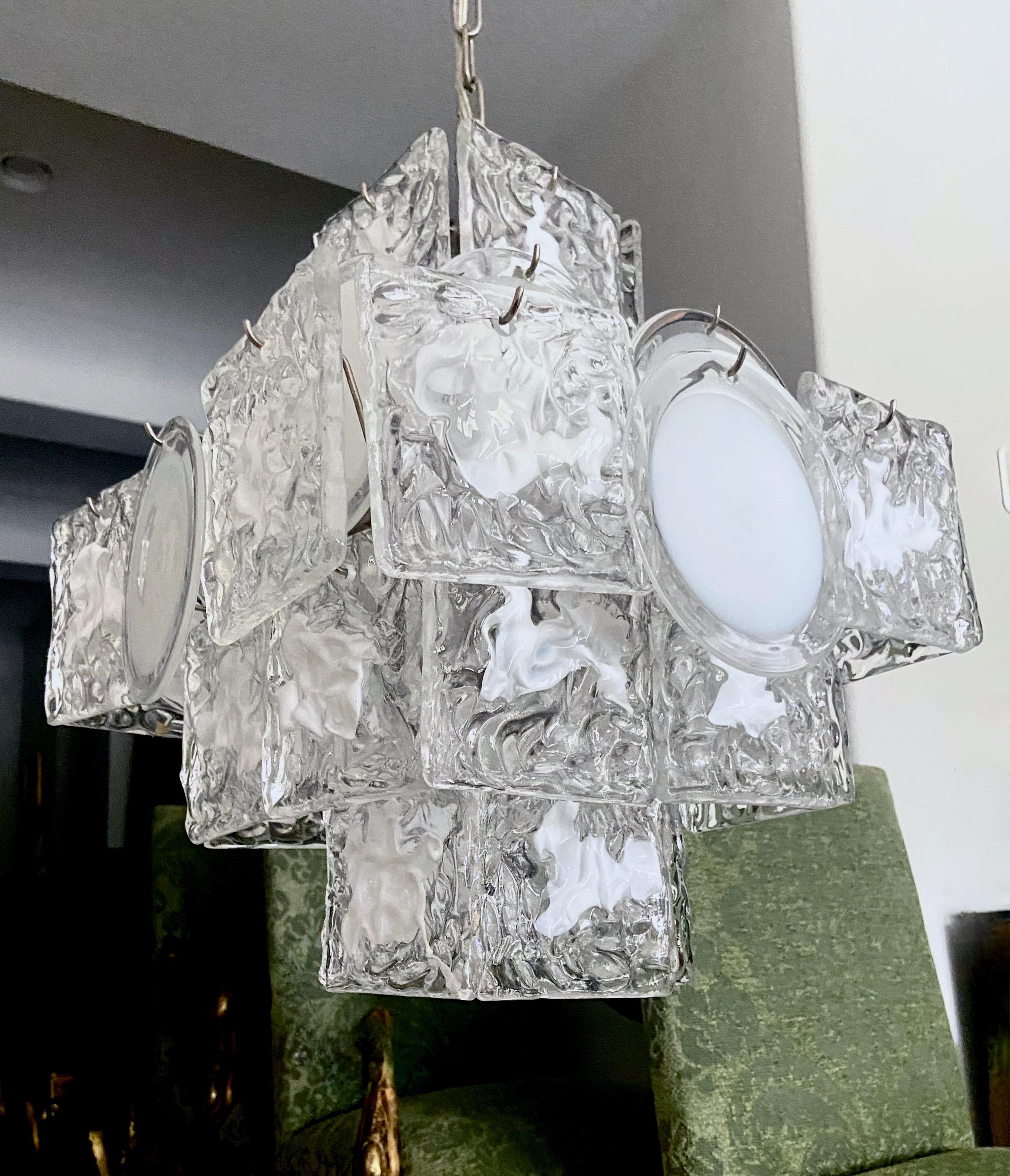 Murano Italian hand blown white and clear glass 4 light square shaped chandelier. The chandelier has 2 styles of alternating glass, Vistosi round clear and white discs, and Mazzega square textured clear and white squiggly pattern discs. Steel frame