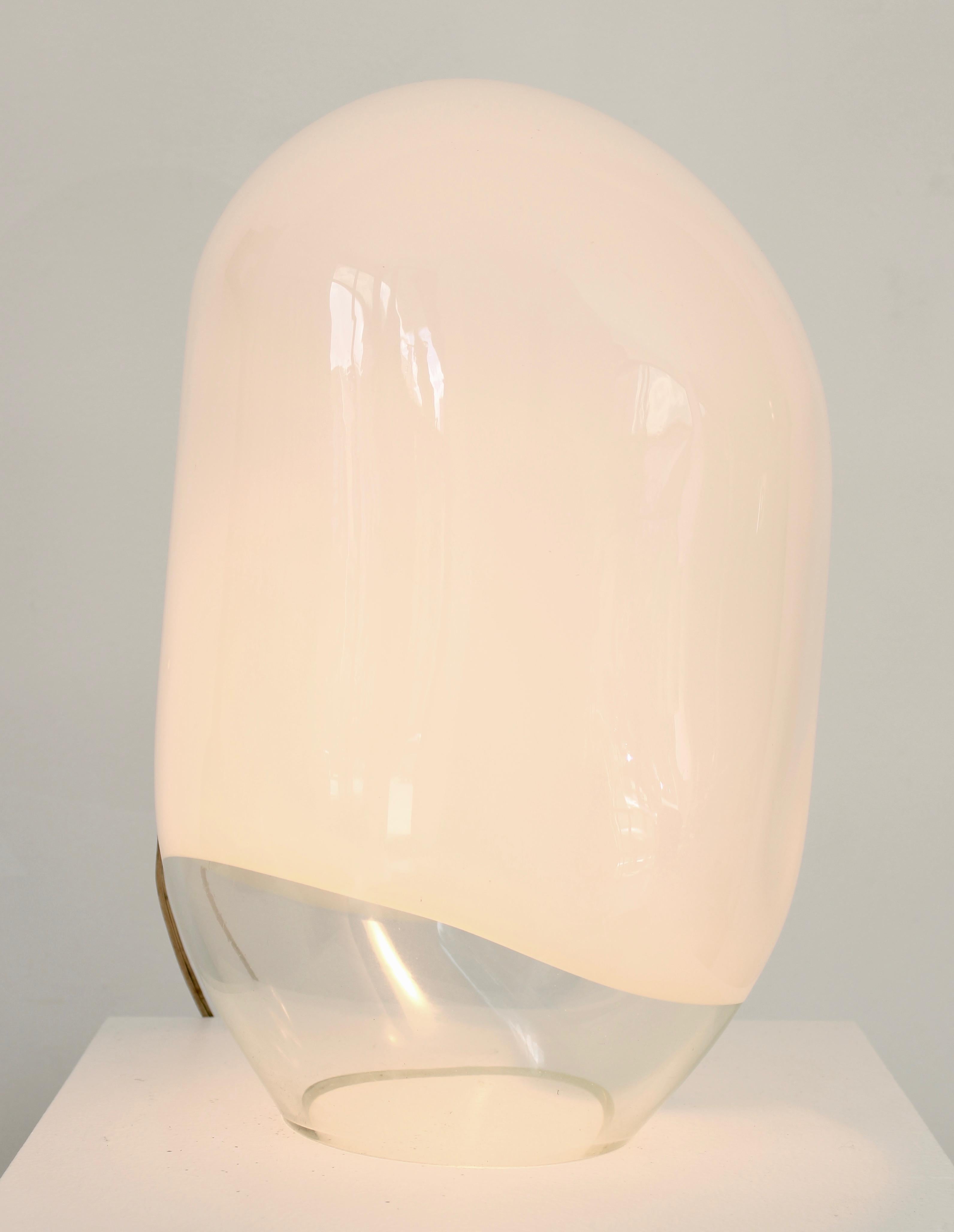 Gino Vistosi Italian Murano blown glass table lamp Munega model circa 1978.
This unusual example has a clear bottom and the opaque glass terminating at a clear section.
Vistosi label intact with original cord and switch but new socket.
Perfect