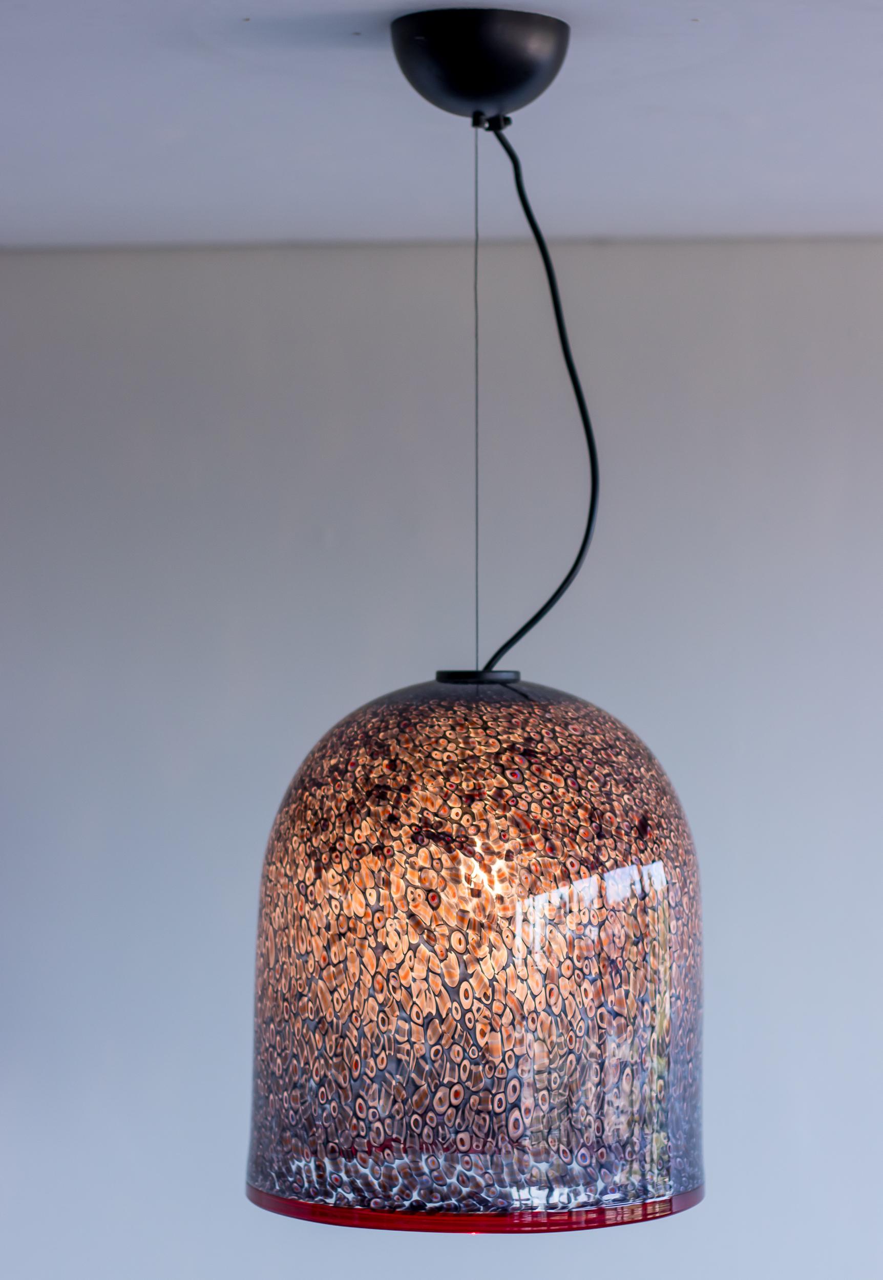 Exceptional glass pendant designed by Gae Aulenti for Vistosi.
Hand blown Murano glass shade with applied murrhines. 
Original canopy with height adjustable steel cable to maximum 300 cm.
Engraved Vistosi.

Literature: Vistosi: Arte e magia del