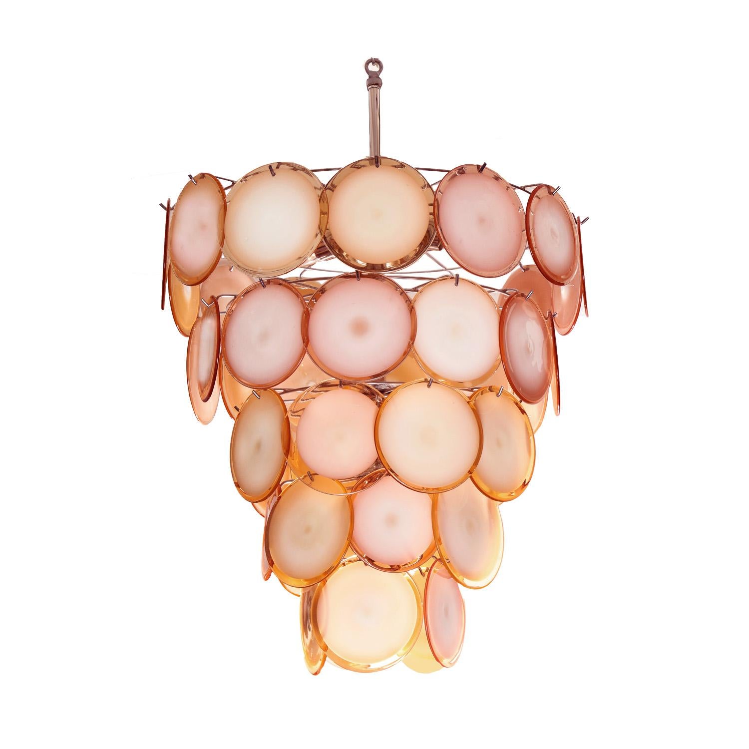 Fantastic pair of Murano peach glass disc chandeliers with chrome frames by Vetreria Vistosi, Italy 1970's.
Available as a pair or sold separately.