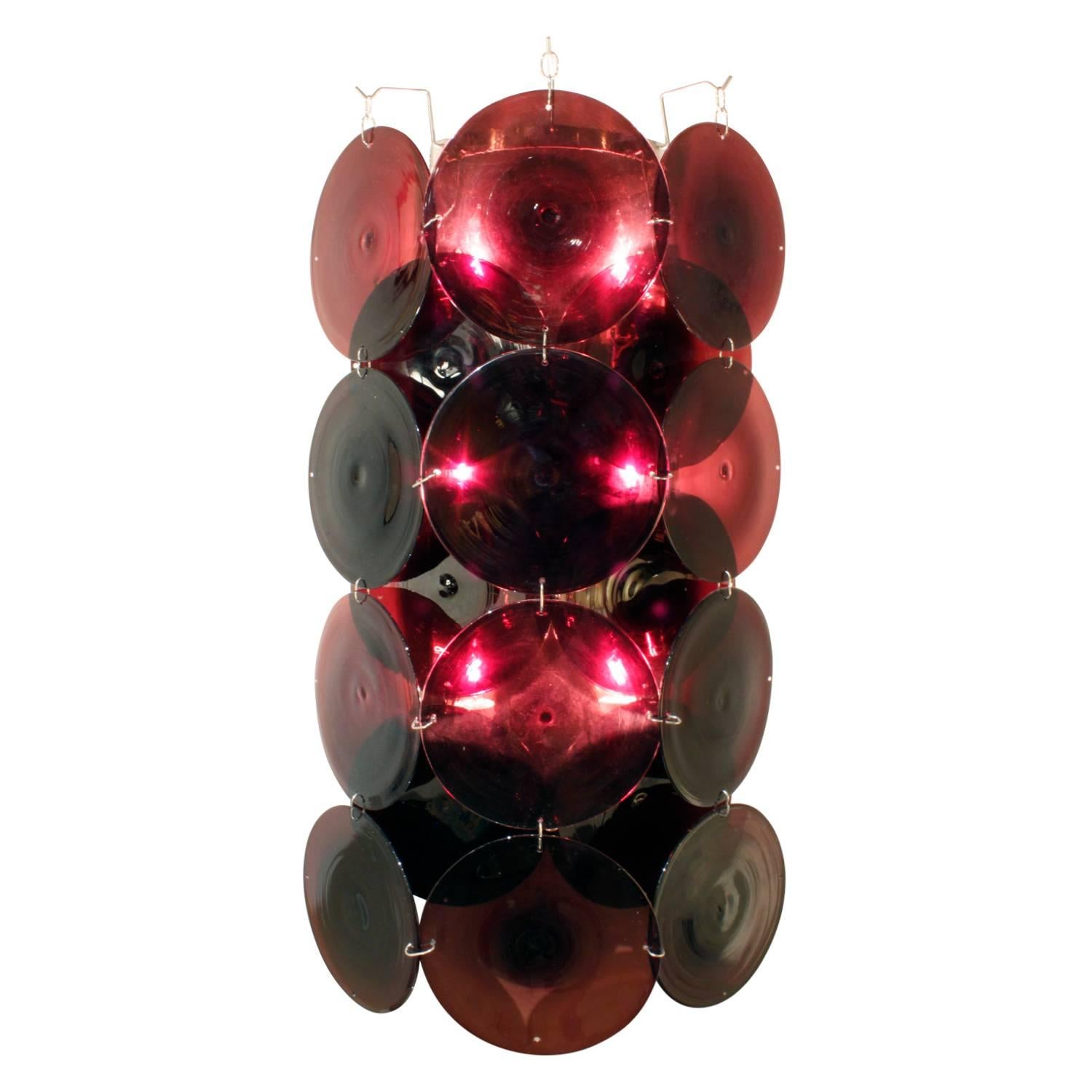 Pair of large sconces with handblown amethyst discs by Vistosi, Murano Italy, 1970s. These sconces are impressive and give off a beautiful light.