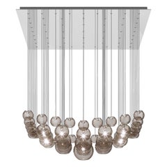Lampe à suspension Vistosi en verre rayé fumé et cadre en acier miroir