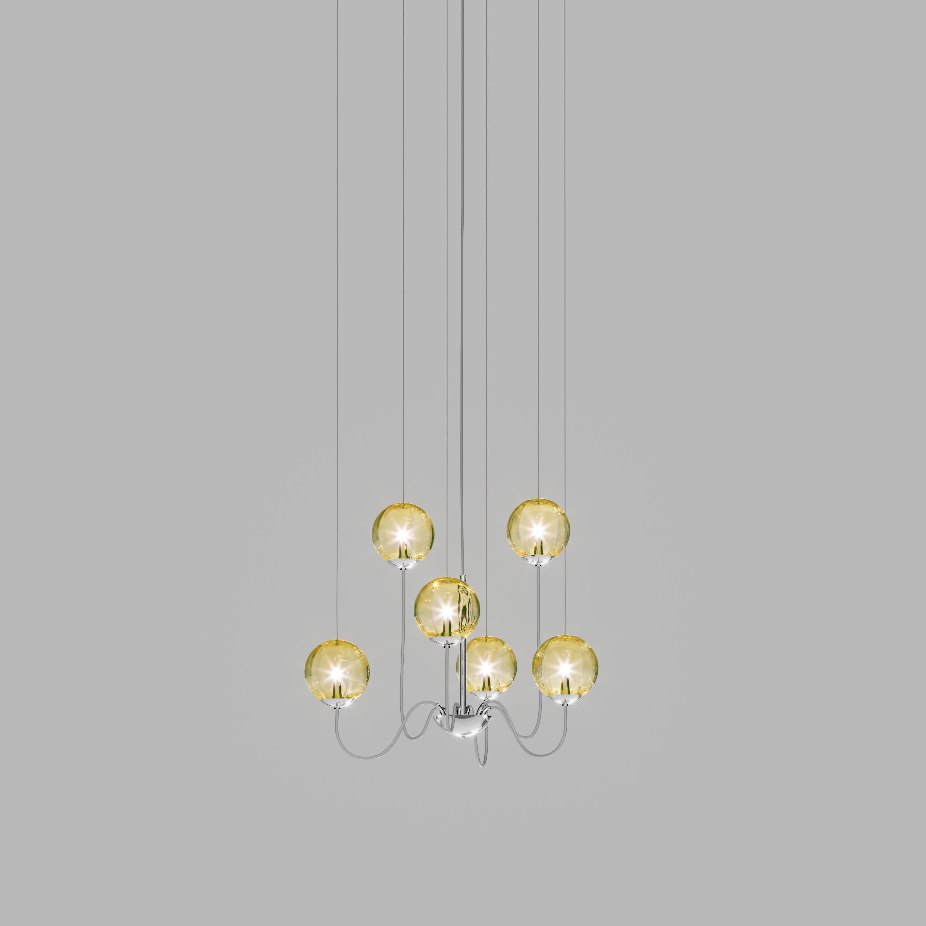 Collection of lamps with a blown and irregular striped glass diffuser. The three sizes of the spheres and the different cable heights are designed to create elegant compositions. The chandelier version allows to fix the diffusers with steel cables