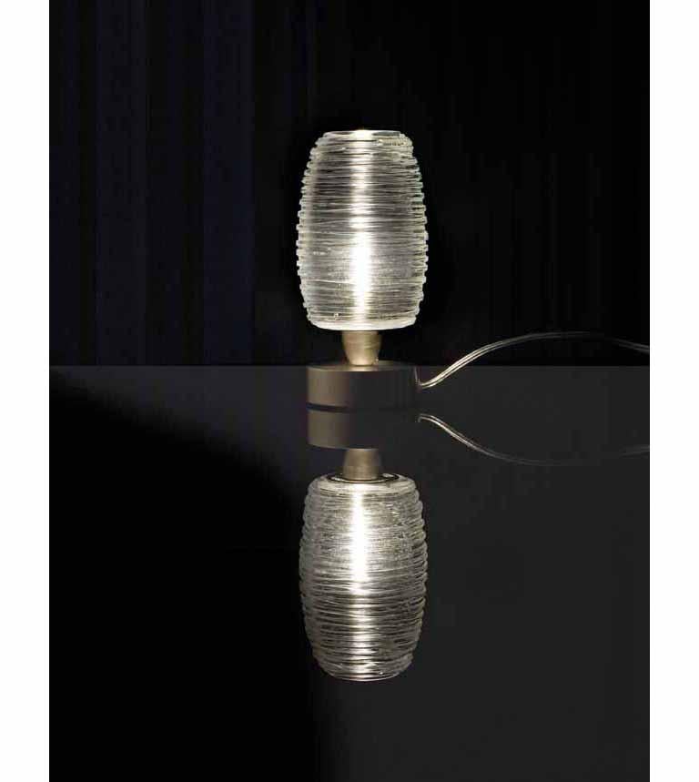 The Damasco series is produced with the bozzolo technique that consists in applying layered threads of molten glass to create an organic texture. Glass color tone in crystal. Metal parts in satin nickel finish. G9 lighting.