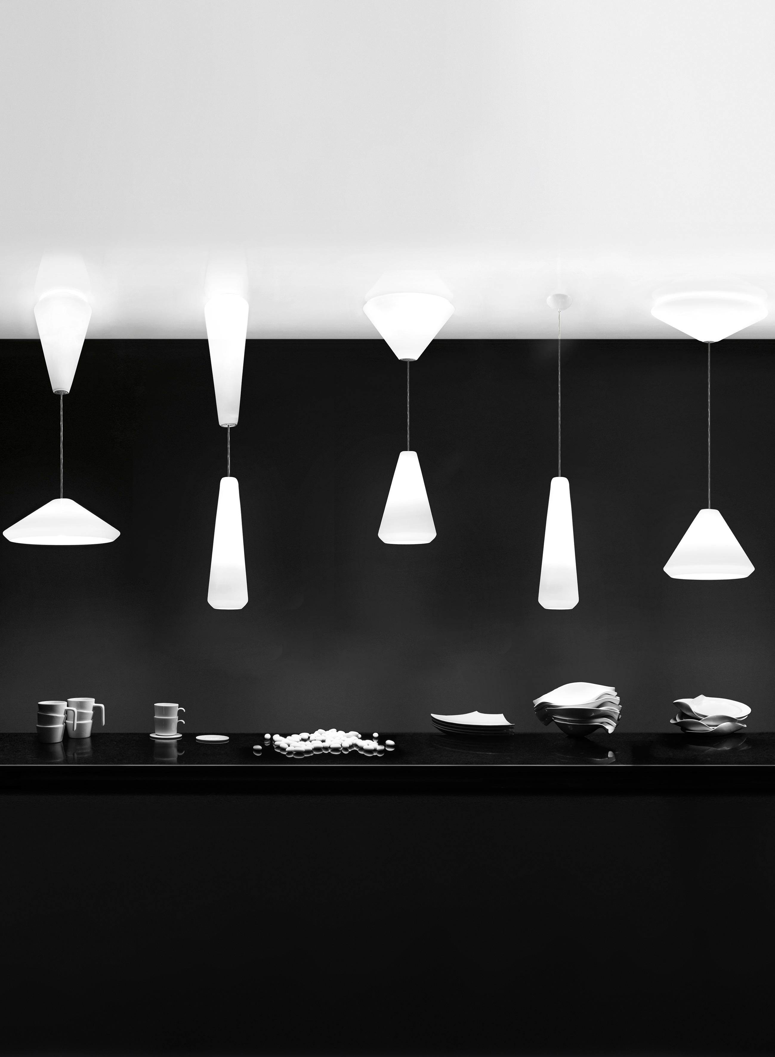 A collection of five single elements in satin-finish blown glass that can be installed as pendants or ceiling fixtures and are ideal for energy saving bulbs. The double glass versions allow a double switch system.

Specifications:
Material: