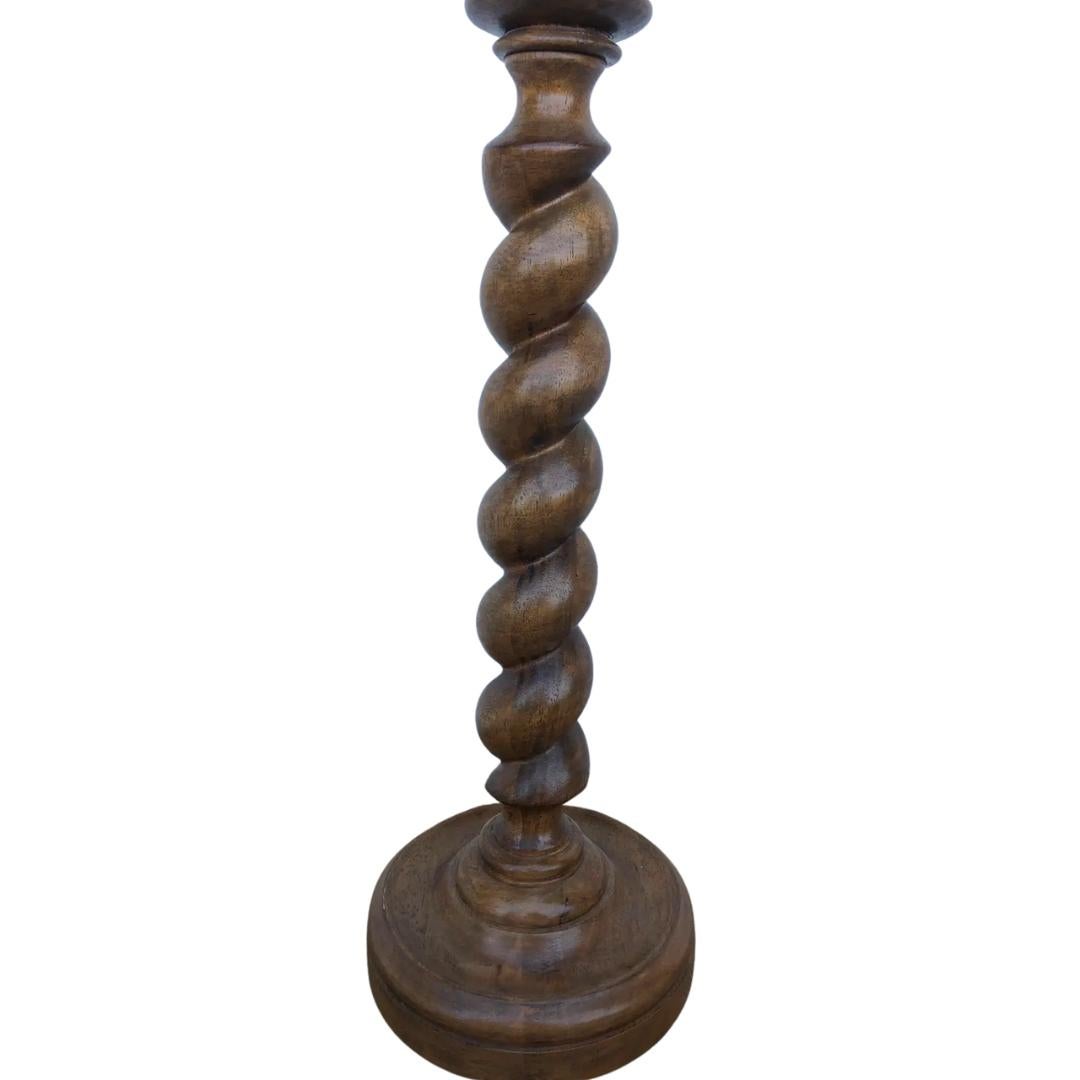 This lovely adjustable height table lamp from Visual Comfort features a tudor twist base with a golden oak finish and a brass accents. This gorgeous lamp is perfect for a home with traditional or transitional style decor! Does not include