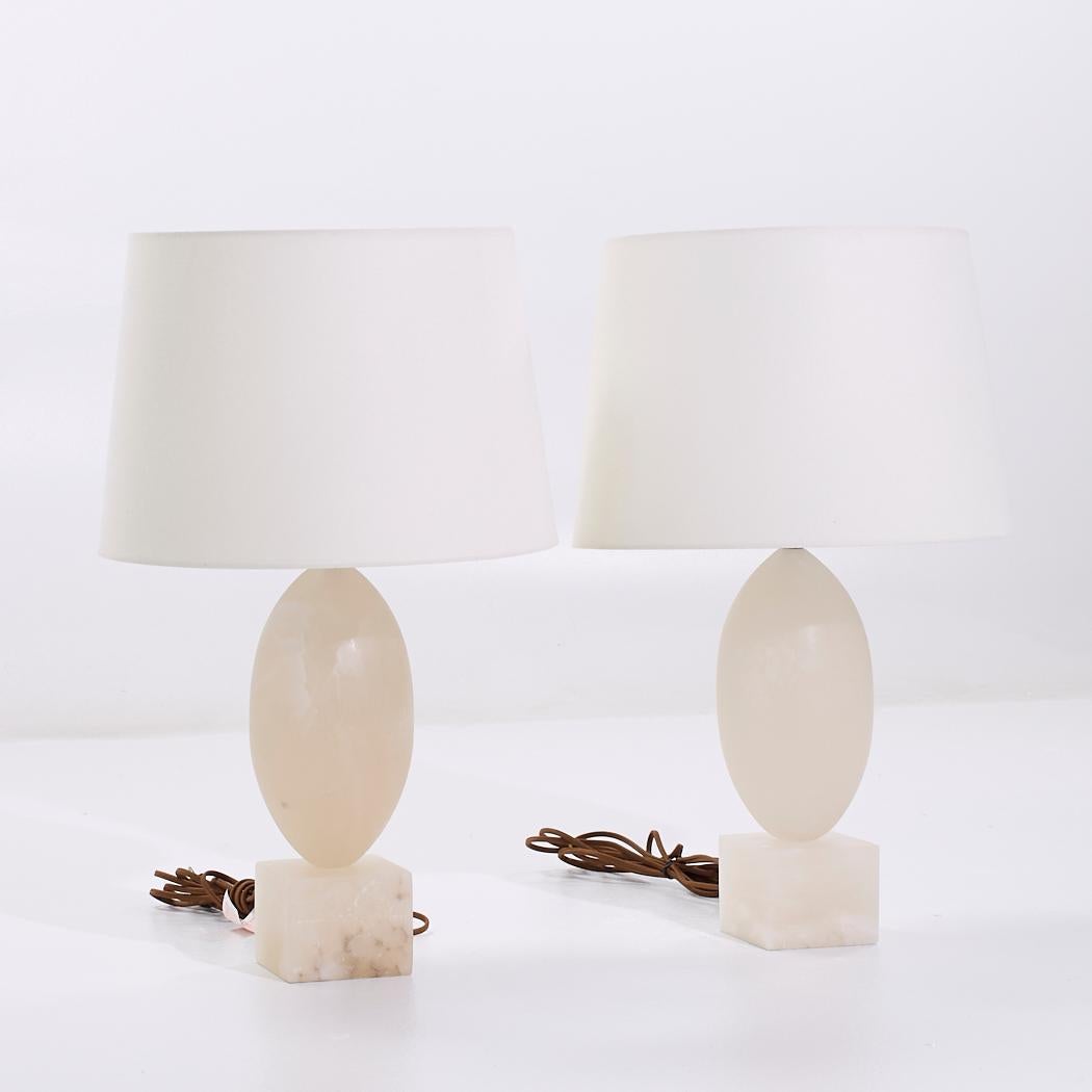 Visual Comfort Versa Alabaster Table Lamps - Pair

Each lamp measures: 18 wide x 18 deep x 29 inches high

We take our photos in a controlled lighting studio to show as much detail as possible. We do not Photoshop out blemishes.

CONDITION: This