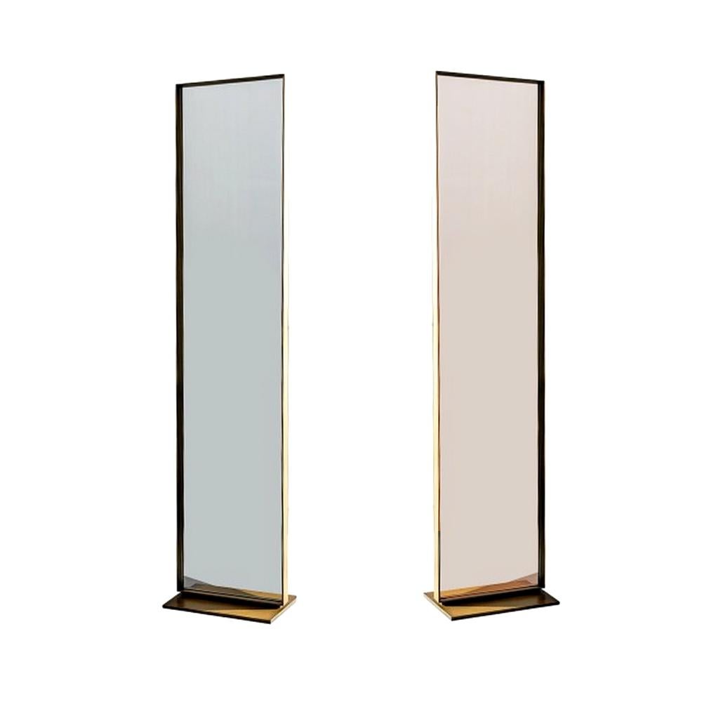 Type COLLECTIONI in the search bar to view 300 unique products like this one.

Two-side free standing rectangular mirror with metal base and lacquered aluminum frame. Structure is made of burnished brass metal. One side is clear mirror and the other