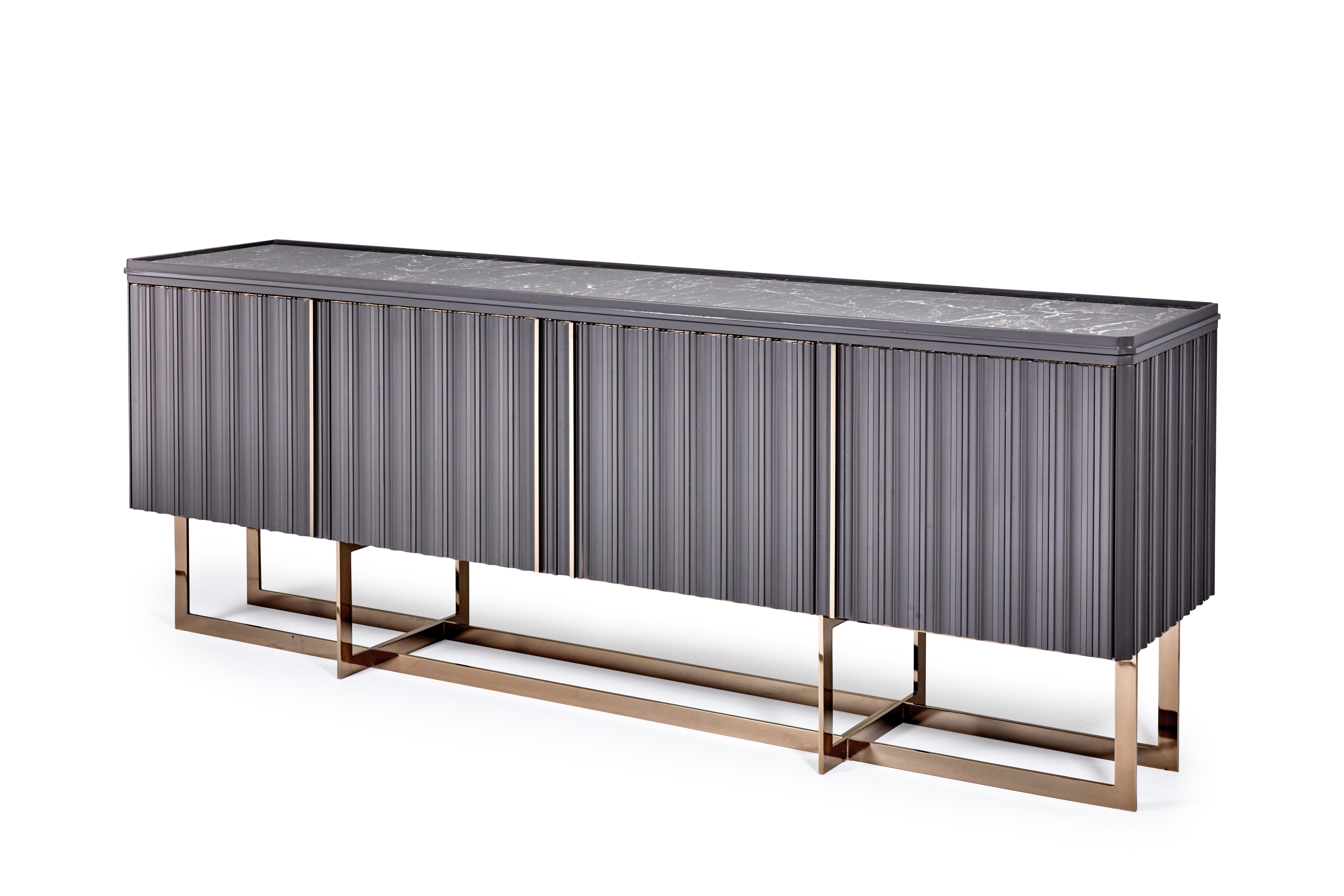 Designed to be noticed, this dynamic cabinet features a fluted outer cabinet inset with a marble top, upon bronze legs. Detail is everything, and this piece uses every inch to exemplify our passion for pure materials and craftsmanship.